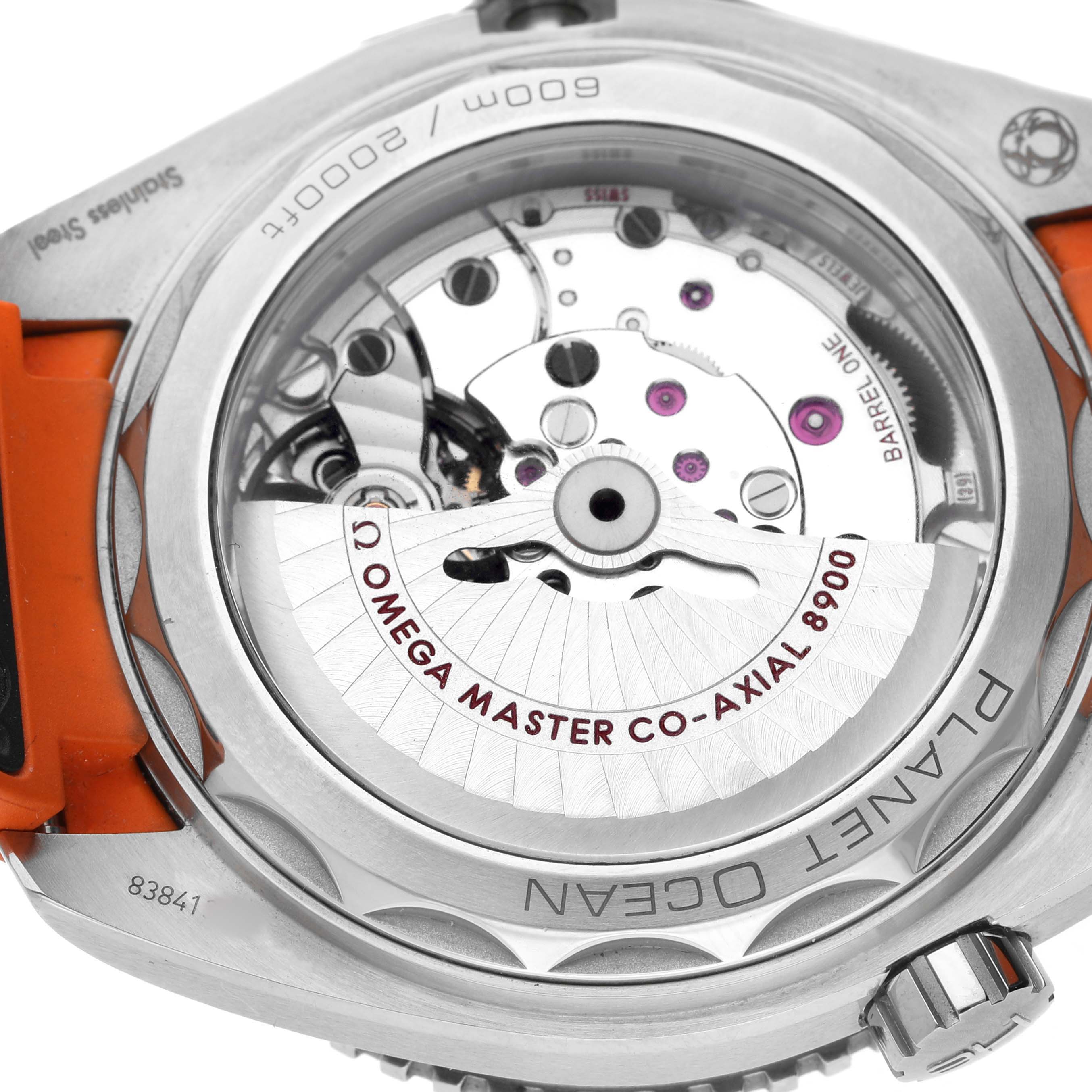 The image shows the back view of the Omega Planet Ocean 215.32.44.21.01.001 Men's Stainless Steel Black Dial watch, highlighting the Co-Axial 8900 movement through the transparent case back.