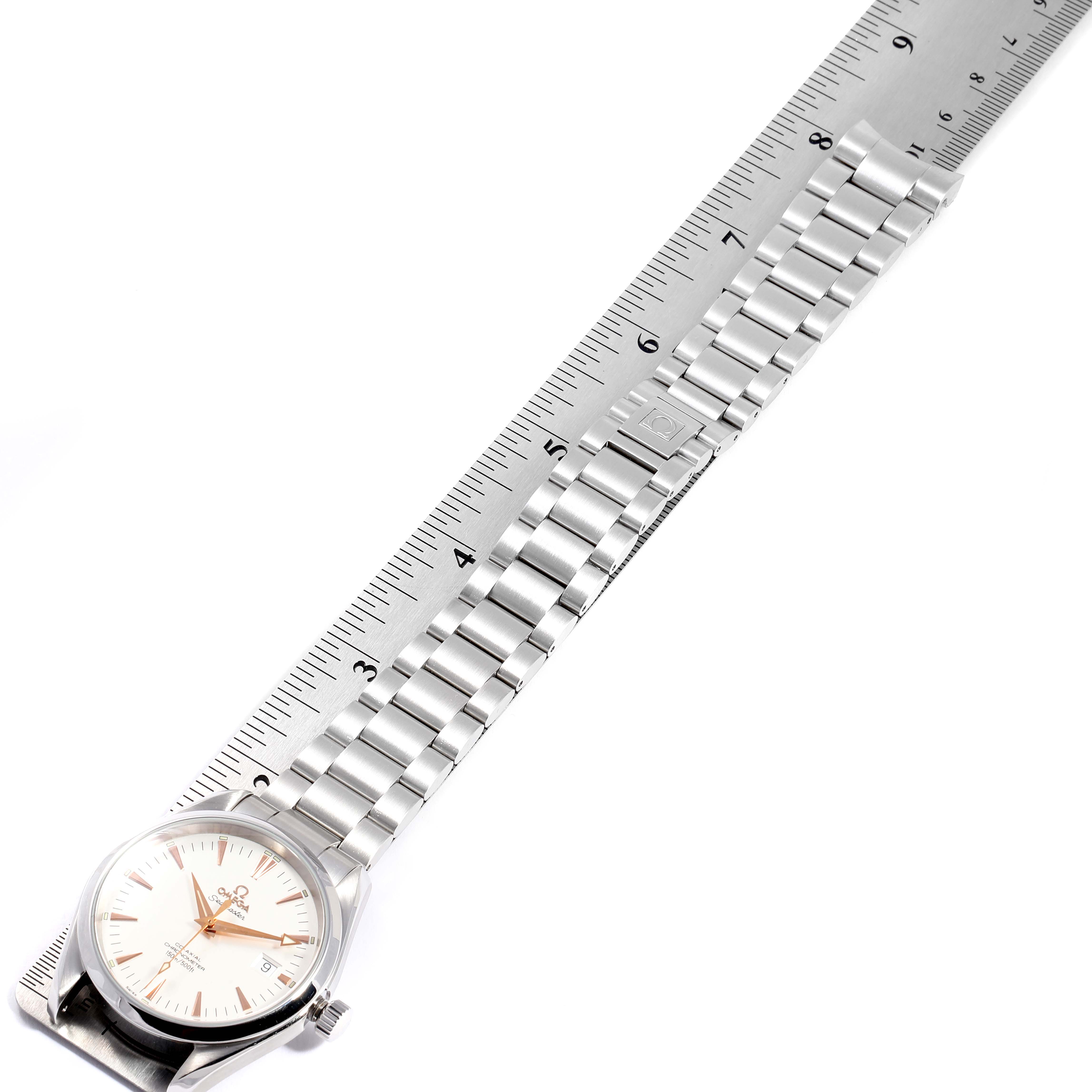 The Omega Seamaster 2503.34.00 Men
s Stainless Steel Silver Dial 2503.34.00 Men
s Stainless Steel Silver Dial watch is shown with its full metal bracelet, laid out next to a ruler for measurement.