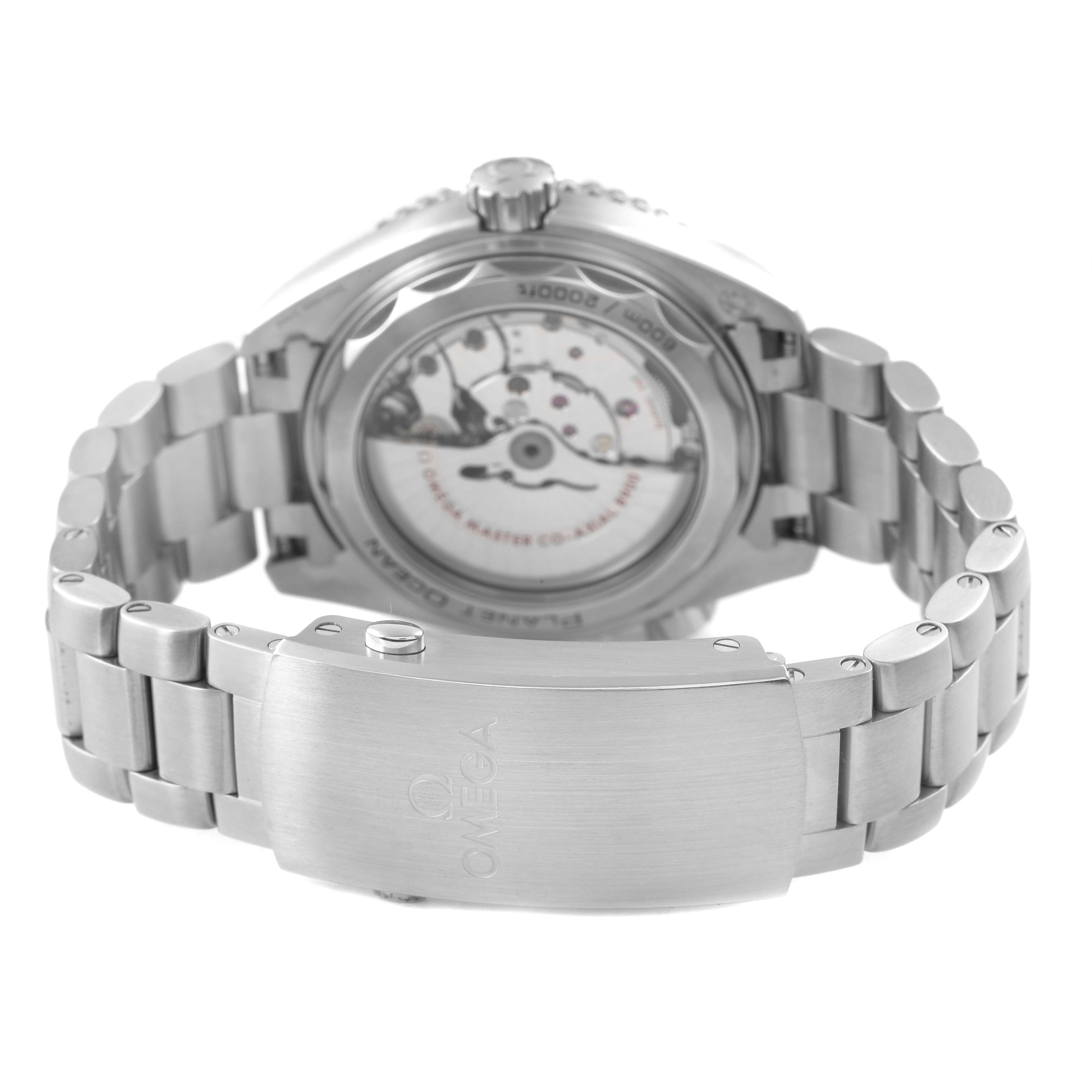 The Omega Planet Ocean 215.30.44.21.03.001 Men's Stainless Steel Blue Dial watch is shown from the back, highlighting the open case back and stainless steel bracelet with clasp.