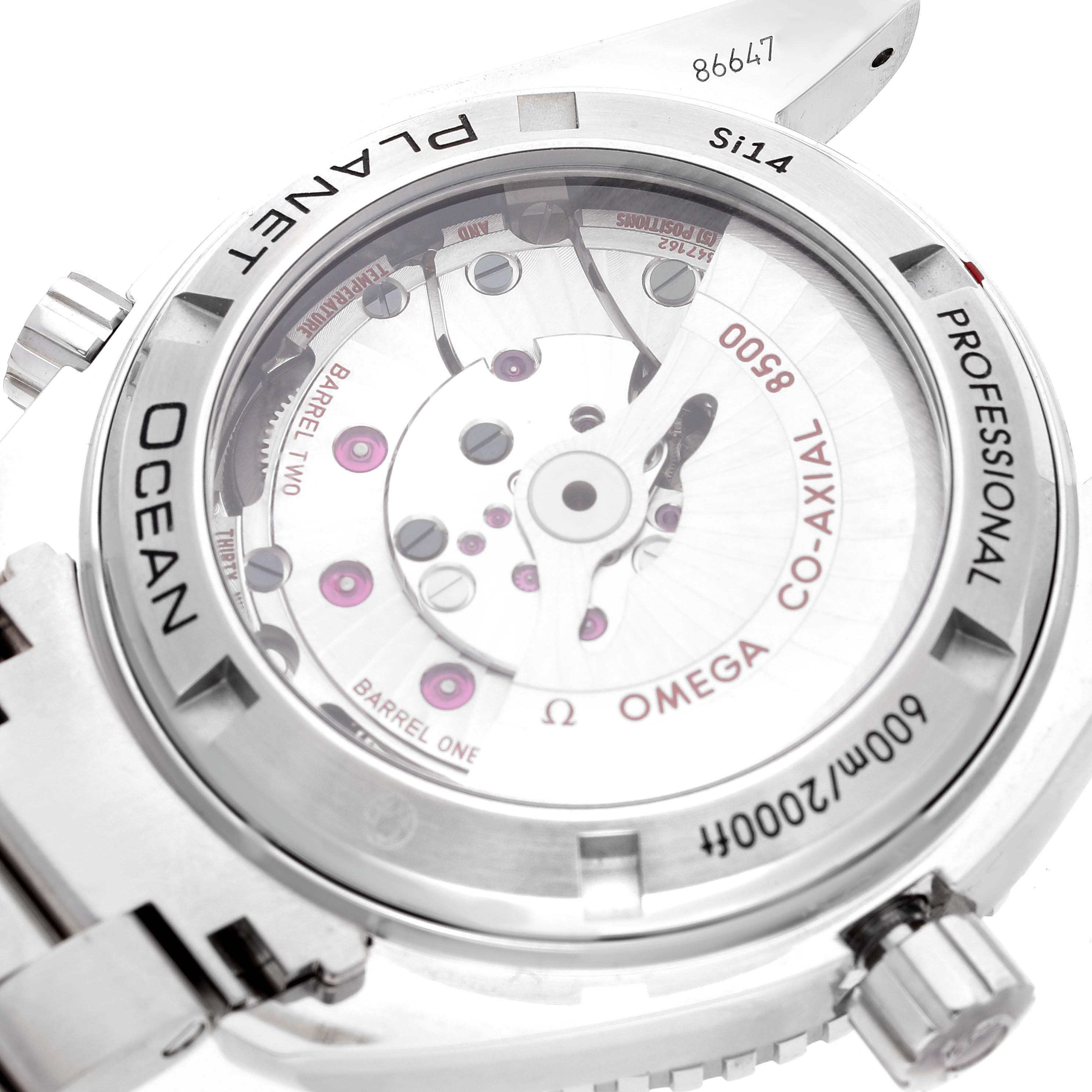 The image shows the back case and movement of the Omega Planet Ocean 232.30.42.21.01.002 Men
s Stainless Steel Black Dial 232.30.42.21.01.002 Men
s Stainless Steel Black Dial watch at an angle, displaying its inner mechanics and inscriptions.