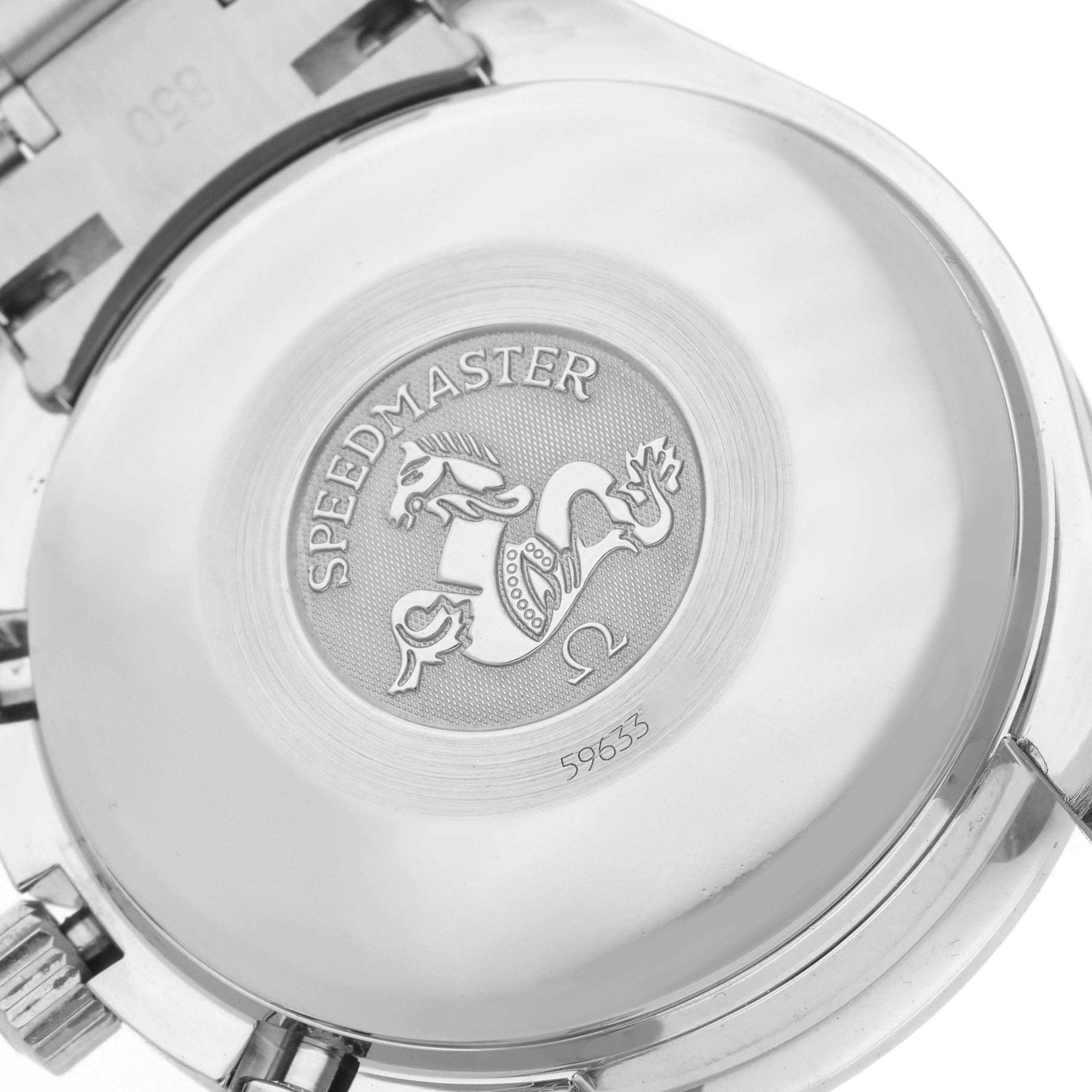 The image shows the case back of an Omega Speedmaster 3523.80.00 Men
s Stainless Steel Blue Dial 3523.80.00 Men
s Stainless Steel Blue Dial, displaying its engraved logo and serial number.