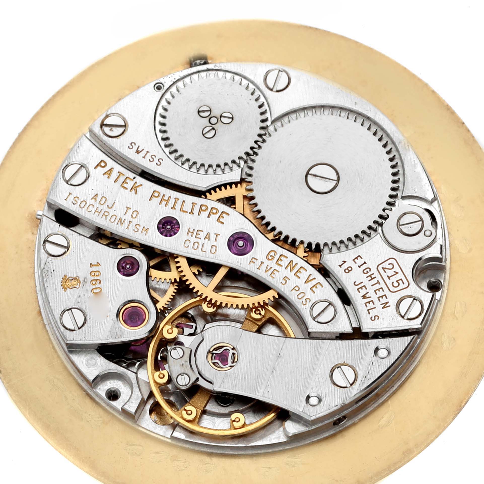 The image shows a close-up view of the movement mechanics of a Patek Philippe Calatrava 5022 Men's Yellow Gold Champagne Dial 5022 Men's Yellow Gold Champagne Dial watch.
