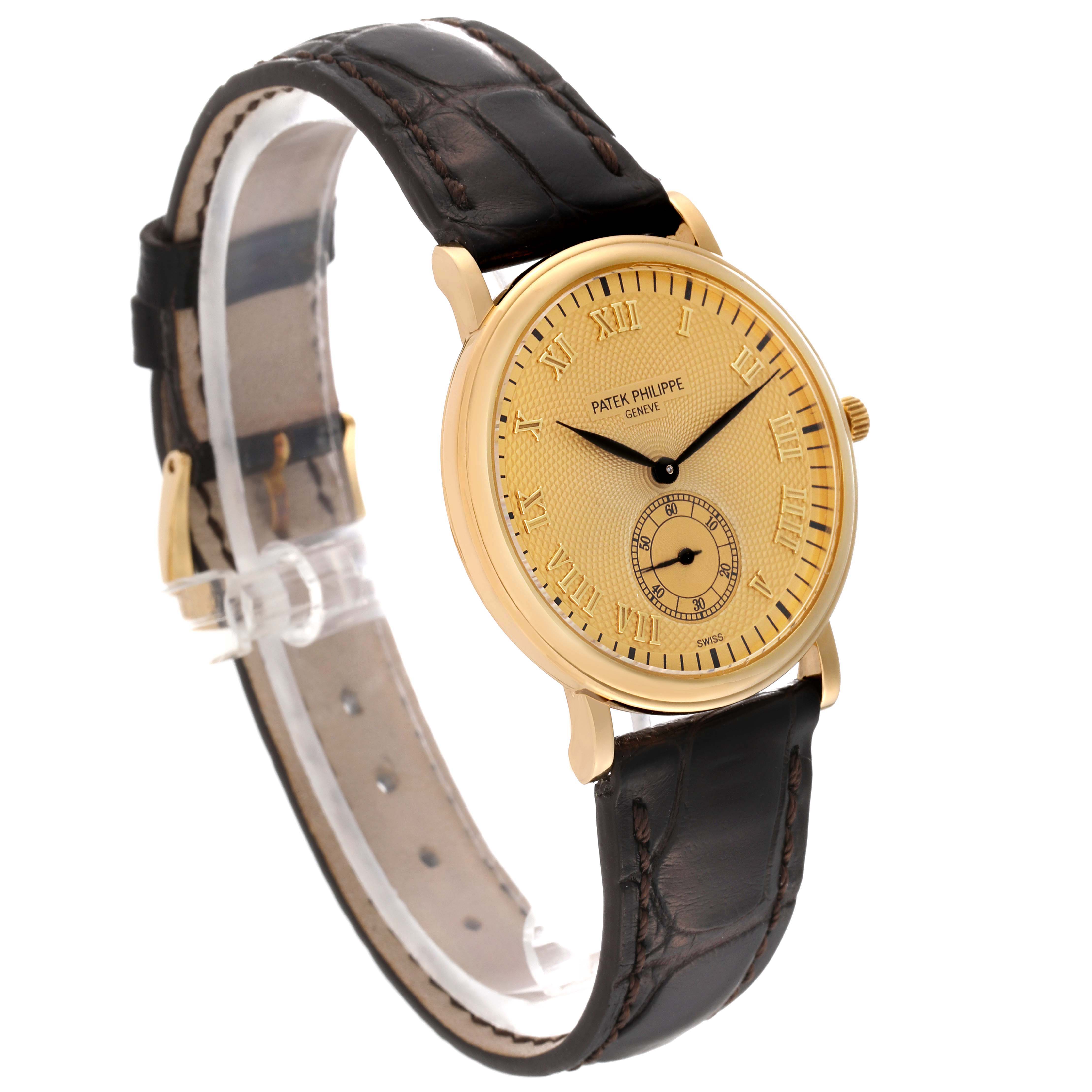 The image shows a Patek Philippe Calatrava 5022 Men's Yellow Gold Champagne Dial 5022 Men's Yellow Gold Champagne Dial watch at a three-quarter angle, highlighting the dial, case, and leather strap.