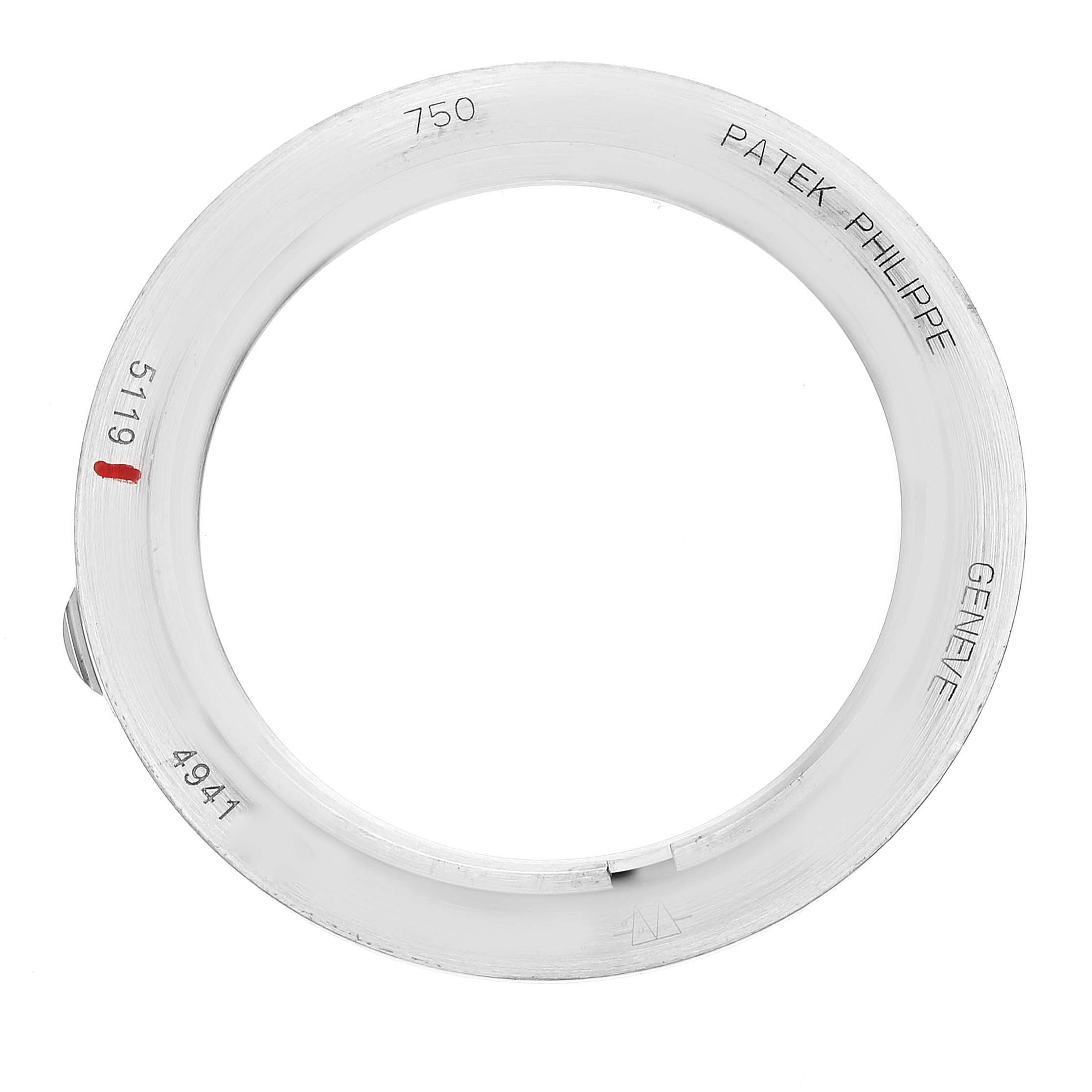 This image shows the bezel of a Patek Philippe Calatrava 5119G Men
s White Gold White Dial 5119G Men
s White Gold White Dial model, displaying the brand name and associated markings.