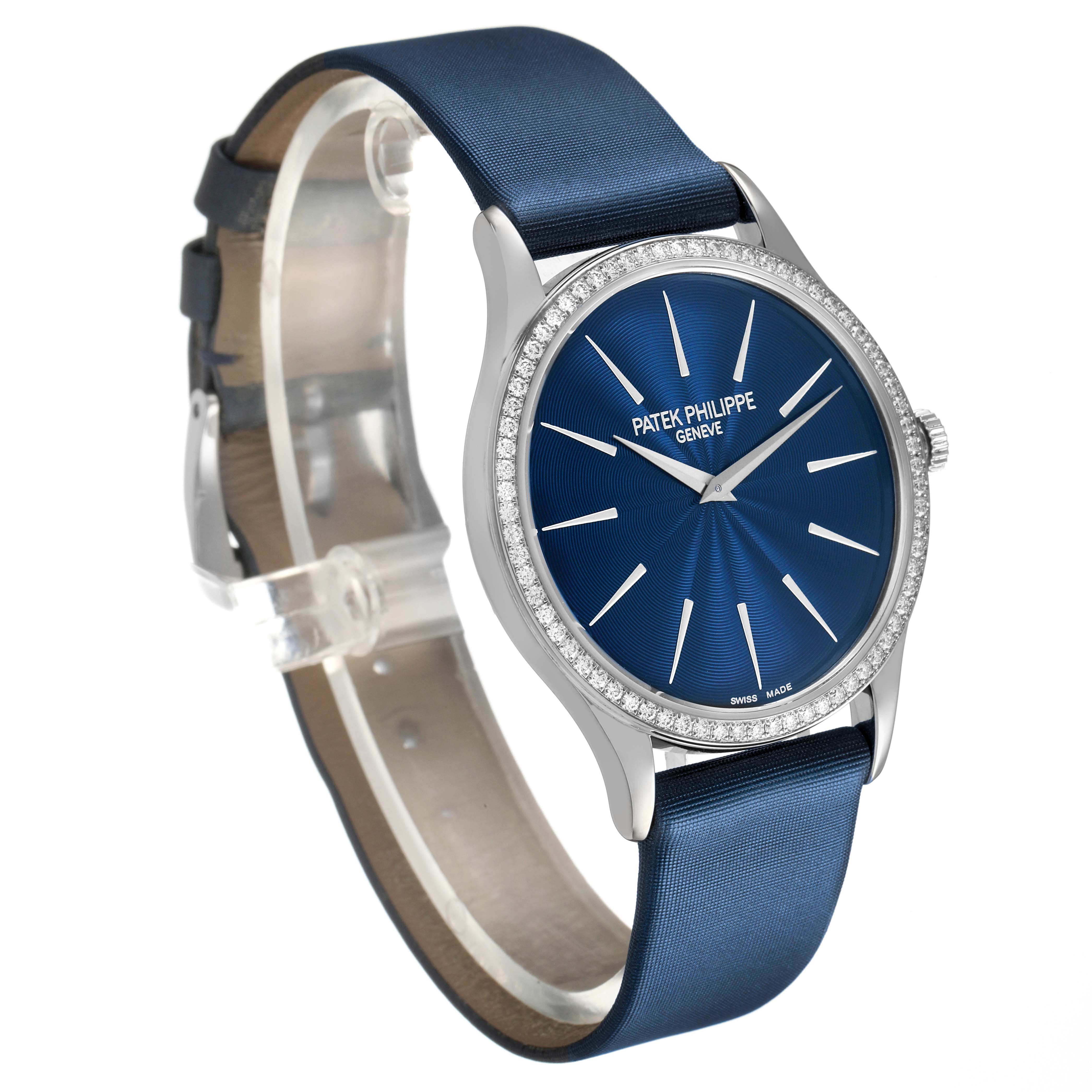 The Patek Philippe Calatrava 4897G-001 Women's White Gold Blue Dial watch is shown at a slight angle, highlighting the blue dial, silver hands, and diamond-set bezel.