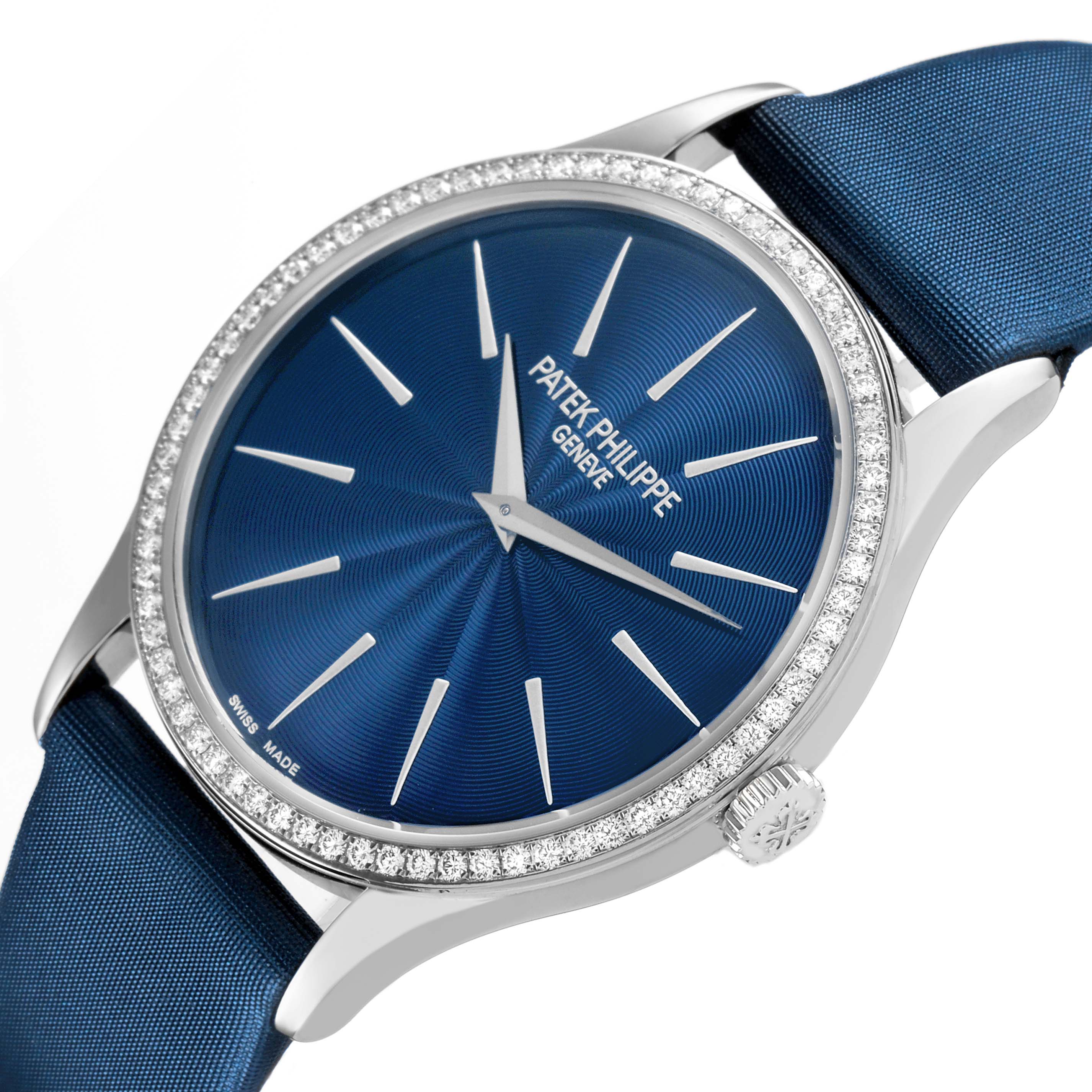 The Patek Philippe Calatrava 4897G-001 Women's White Gold Blue Dial watch is shown at a slight angle, displaying the blue dial, diamond bezel, and crown.