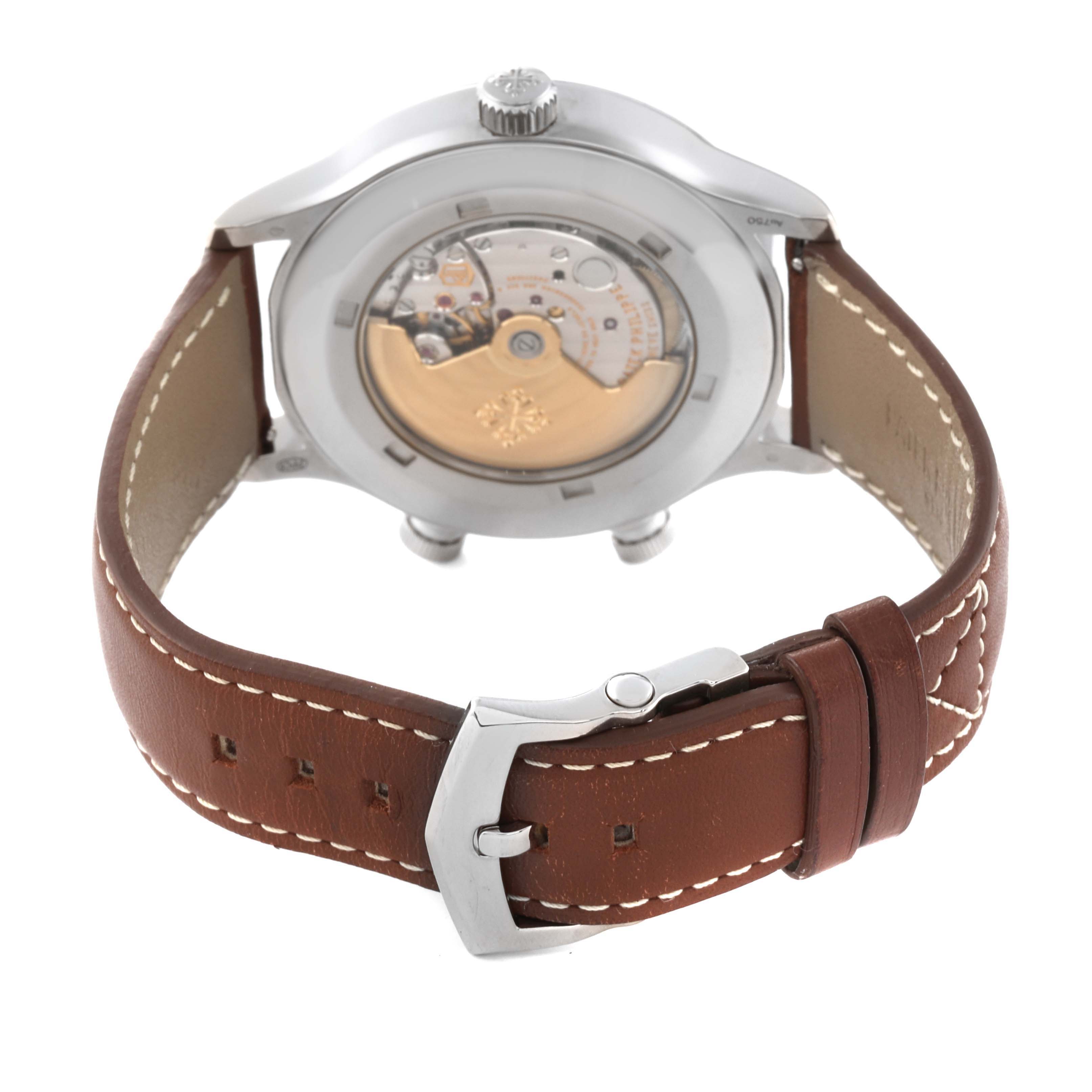 This image shows the back view of a Patek Philippe Calatrava 5524G-001 Men's White Gold Black Dial 5524G-001 Men's White Gold Black Dial watch, highlighting the movement and brown leather strap.