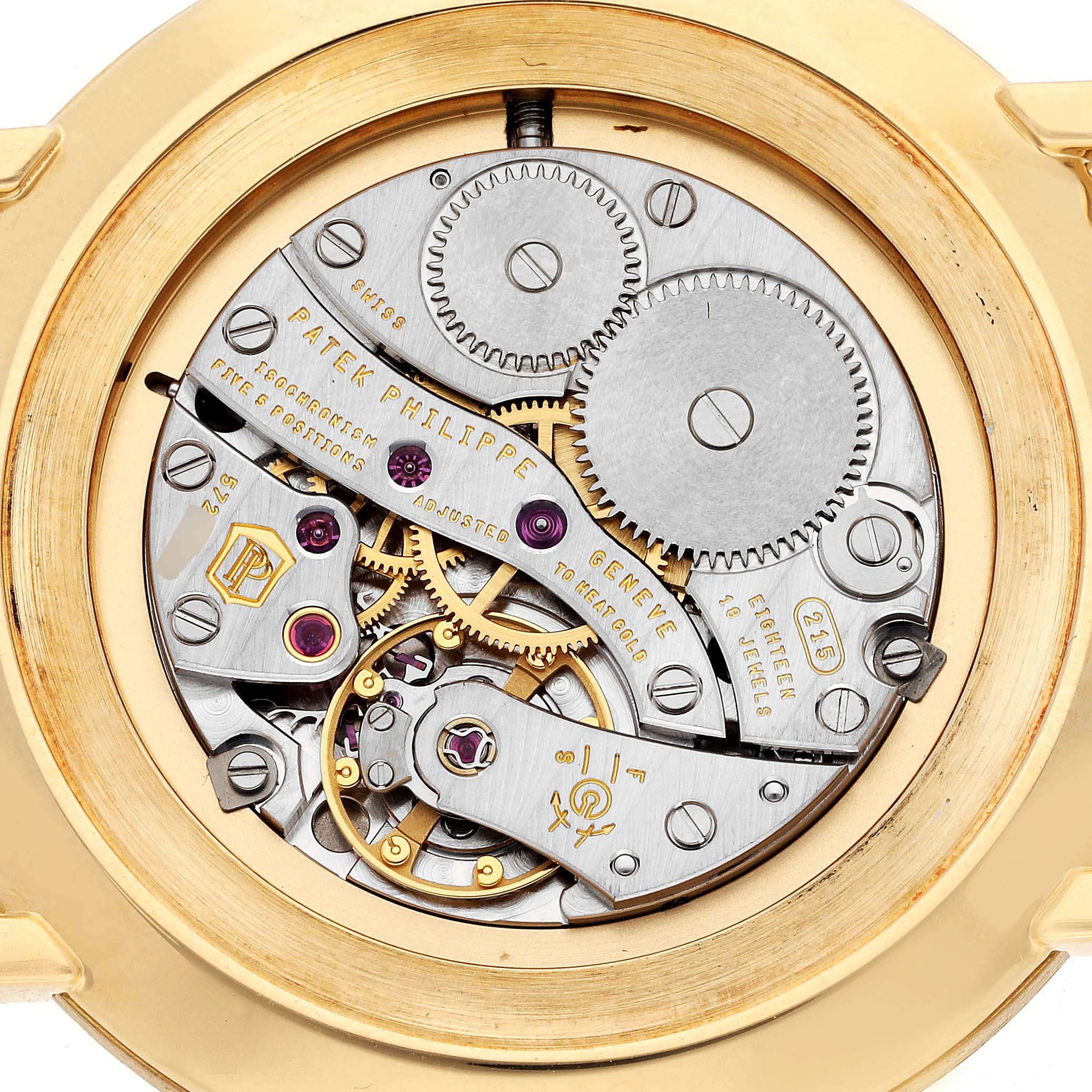 This image shows the intricate internal mechanism of a Patek Philippe Calatrava 5119J Men's Yellow Gold White Dial 5119J Men's Yellow Gold White Dial watch from a rear angle.