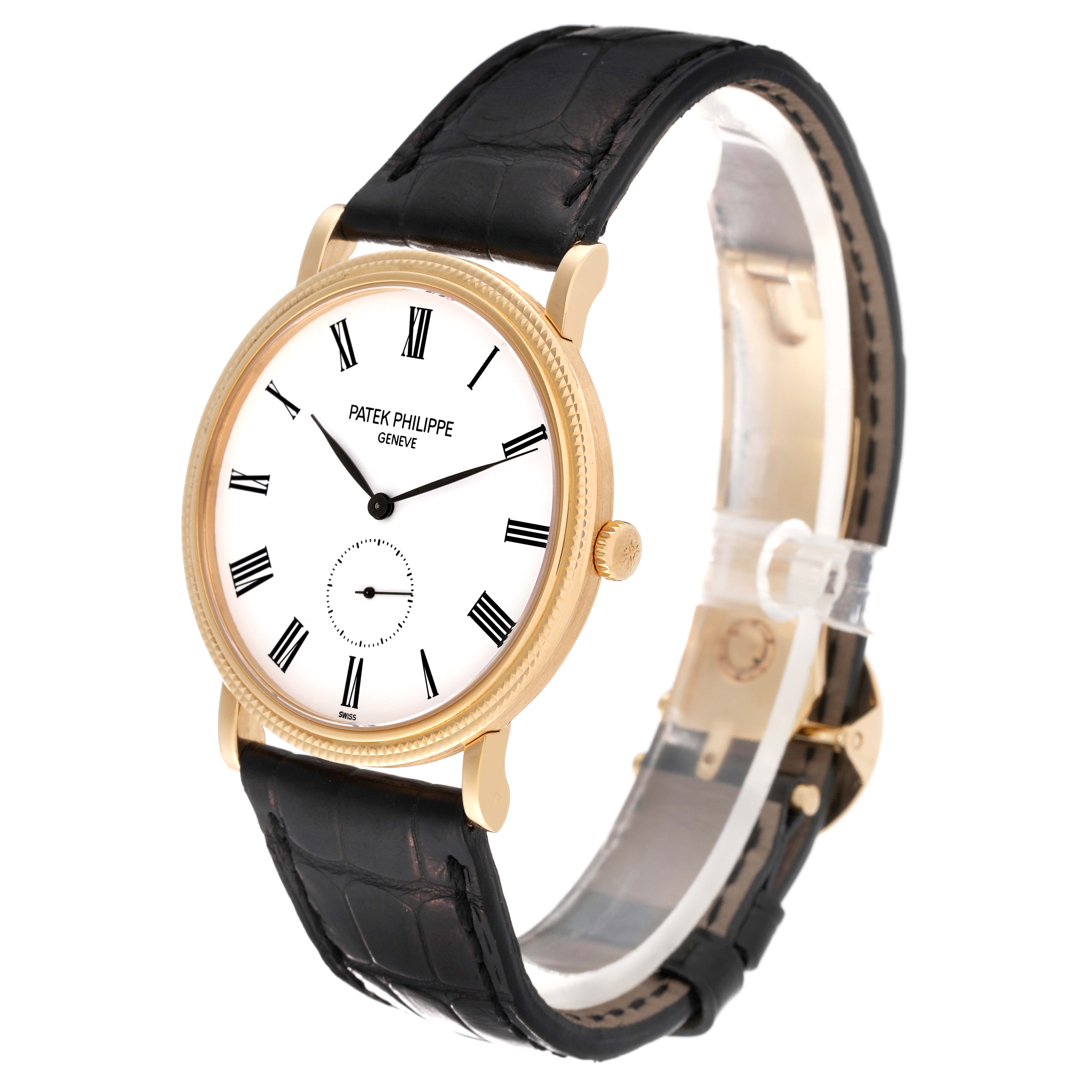 This image shows a Patek Philippe Calatrava 5119J Men's Yellow Gold White Dial 5119J Men's Yellow Gold White Dial watch photographed from the front left side, highlighting the dial, strap, and crown.