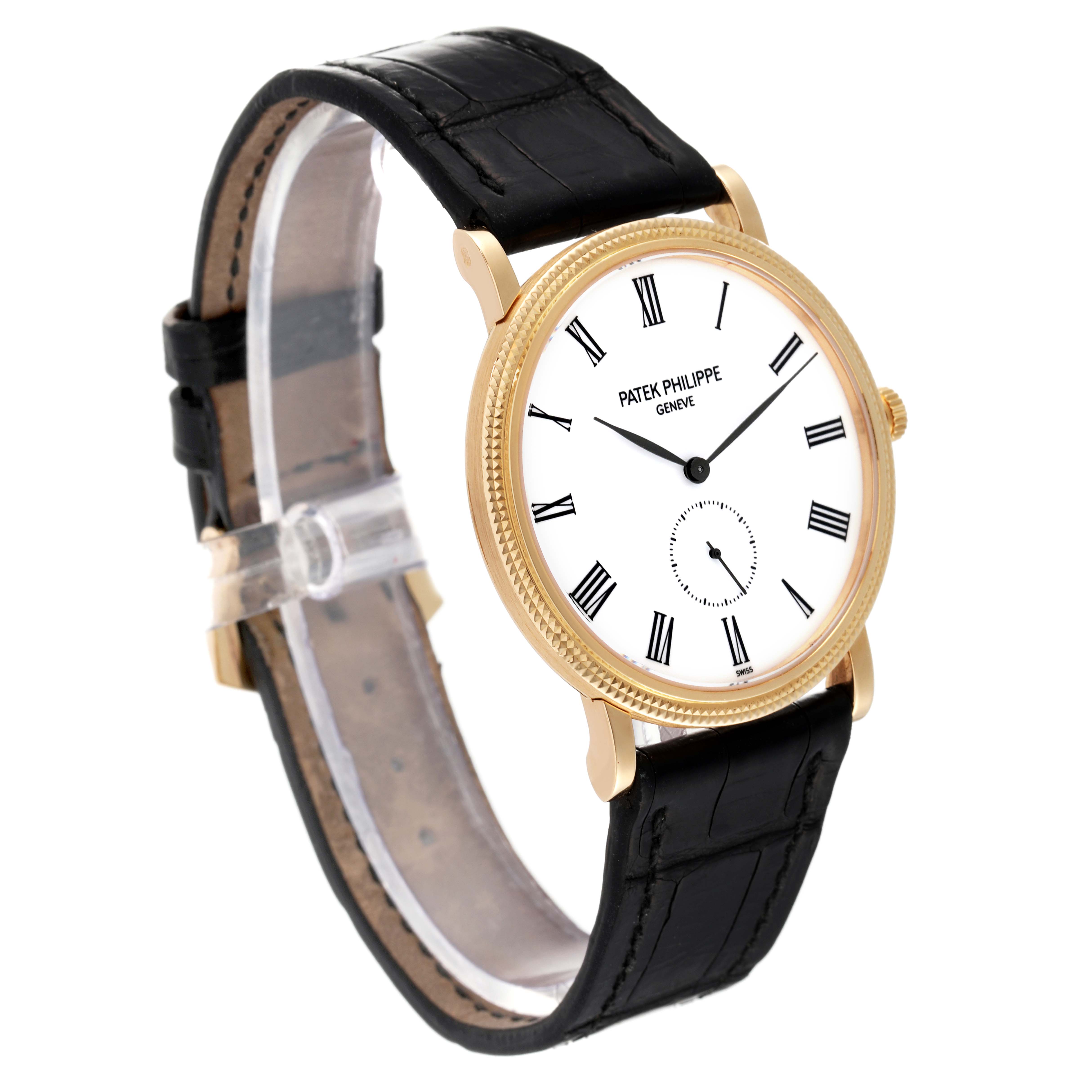 The image shows a side angle of a Patek Philippe Calatrava 5119J Men
s White Gold White Dial 5119J Men
s White Gold White Dial watch, highlighting its gold case, white dial, and black leather strap.