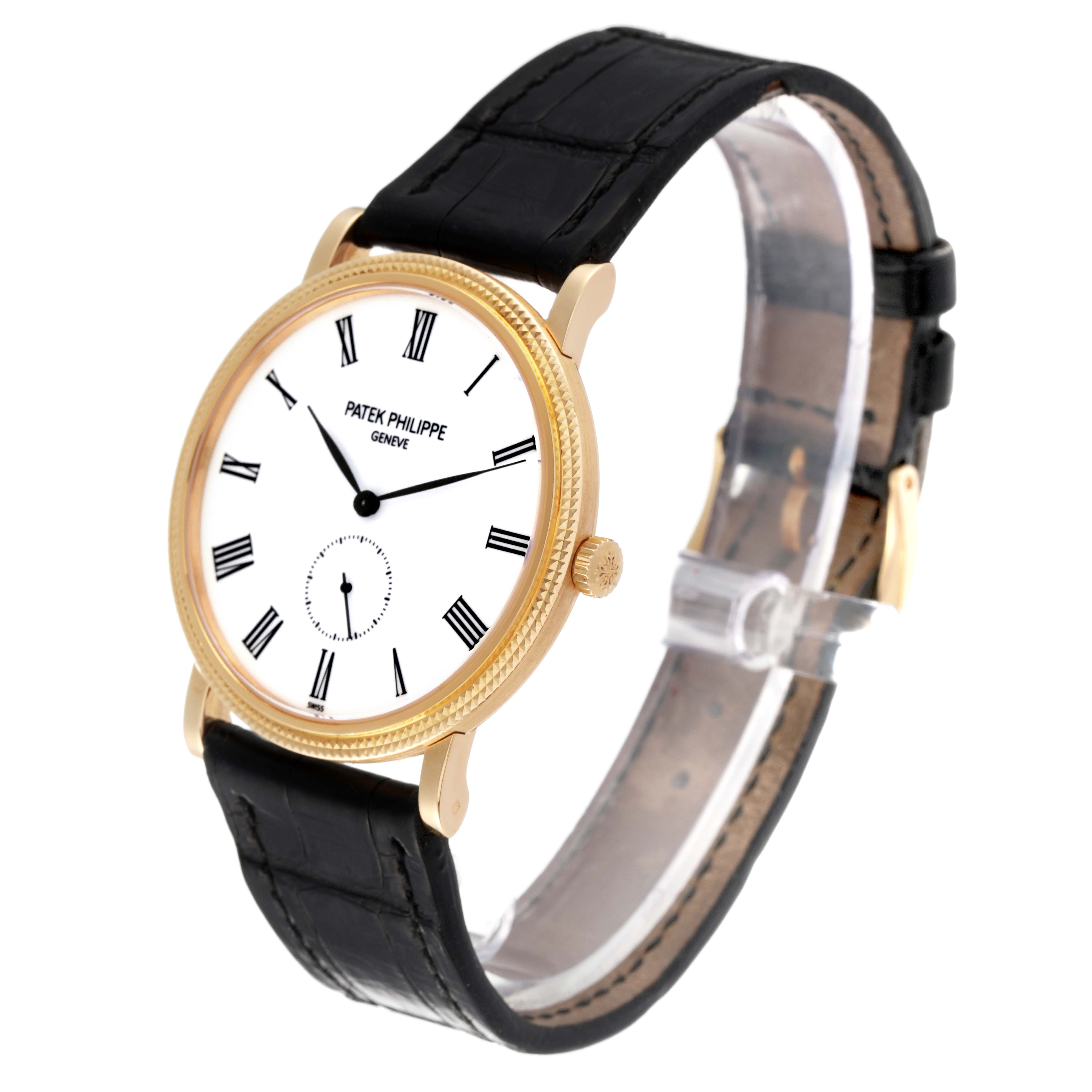 The image shows a Patek Philippe Calatrava 5119J Men
s White Gold White Dial 5119J Men
s White Gold White Dial watch from a slight front-side angle, highlighting the face, bezel, crown, and strap.