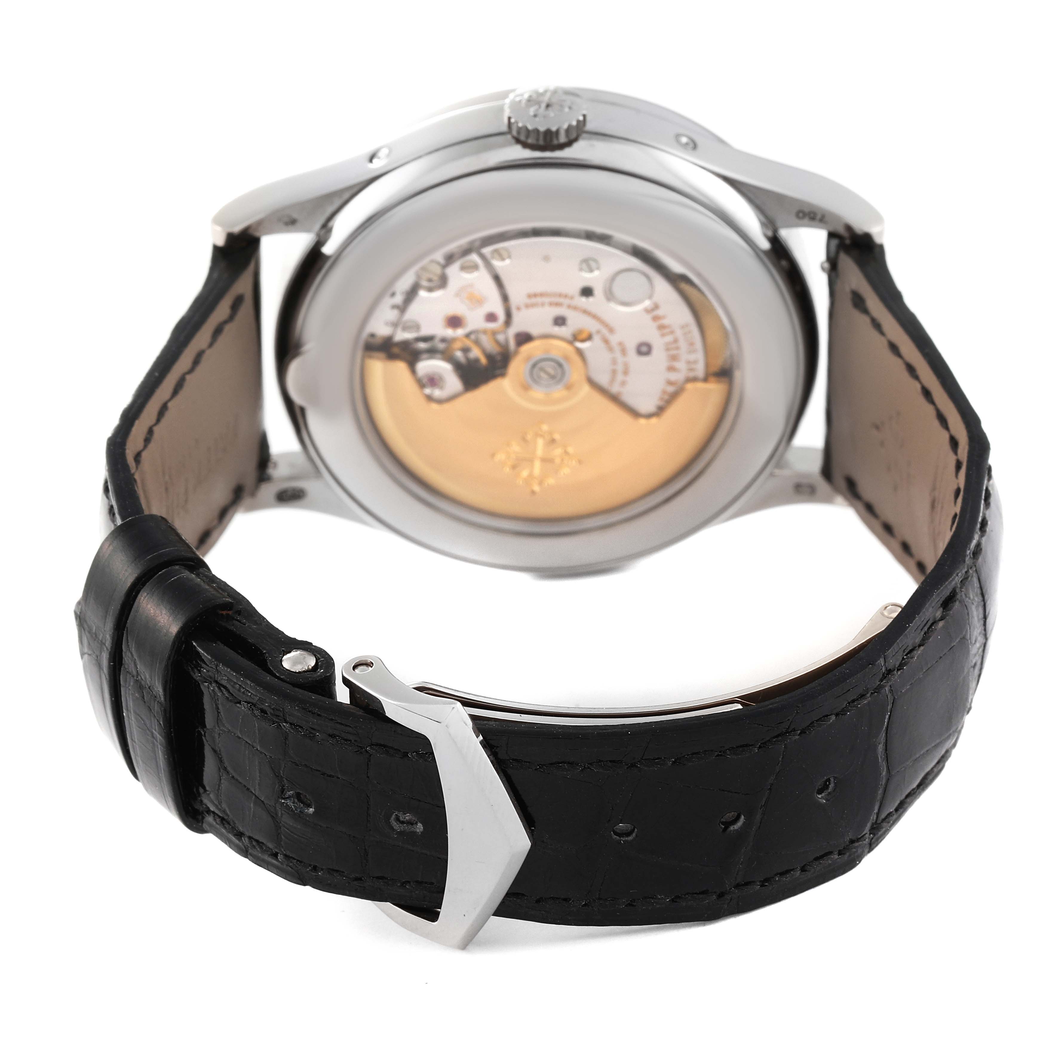 This image shows the back view of a Patek Philippe Complications 5396G Men's White Gold Silver Dial 5396G Men's White Gold Silver Dial watch, highlighting the movement mechanism and black leather strap.