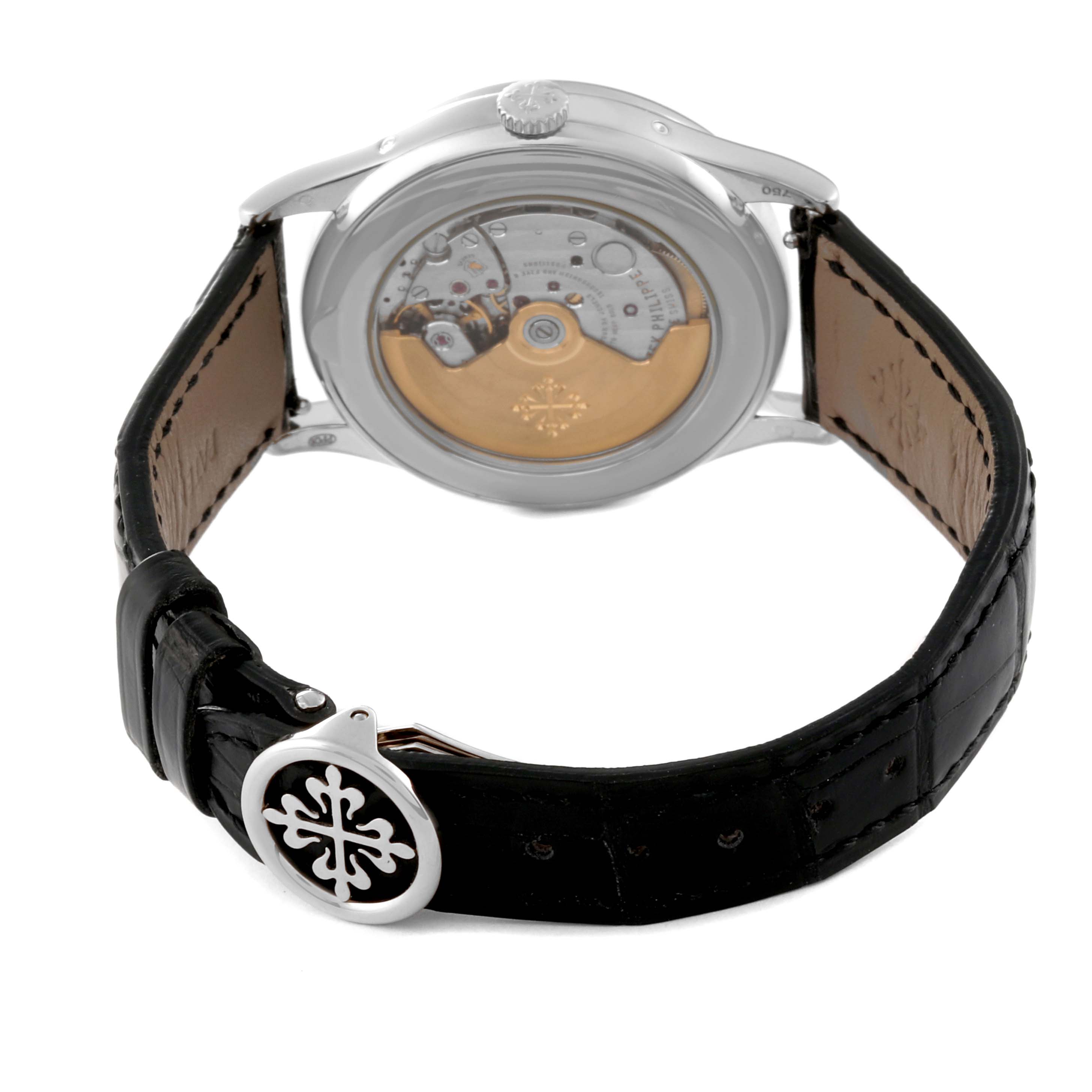 The image shows the back view of a Patek Philippe Complications 5396G Men
s White Gold Silver Dial 5396G Men
s White Gold Silver Dial watch, highlighting the movement and leather strap.