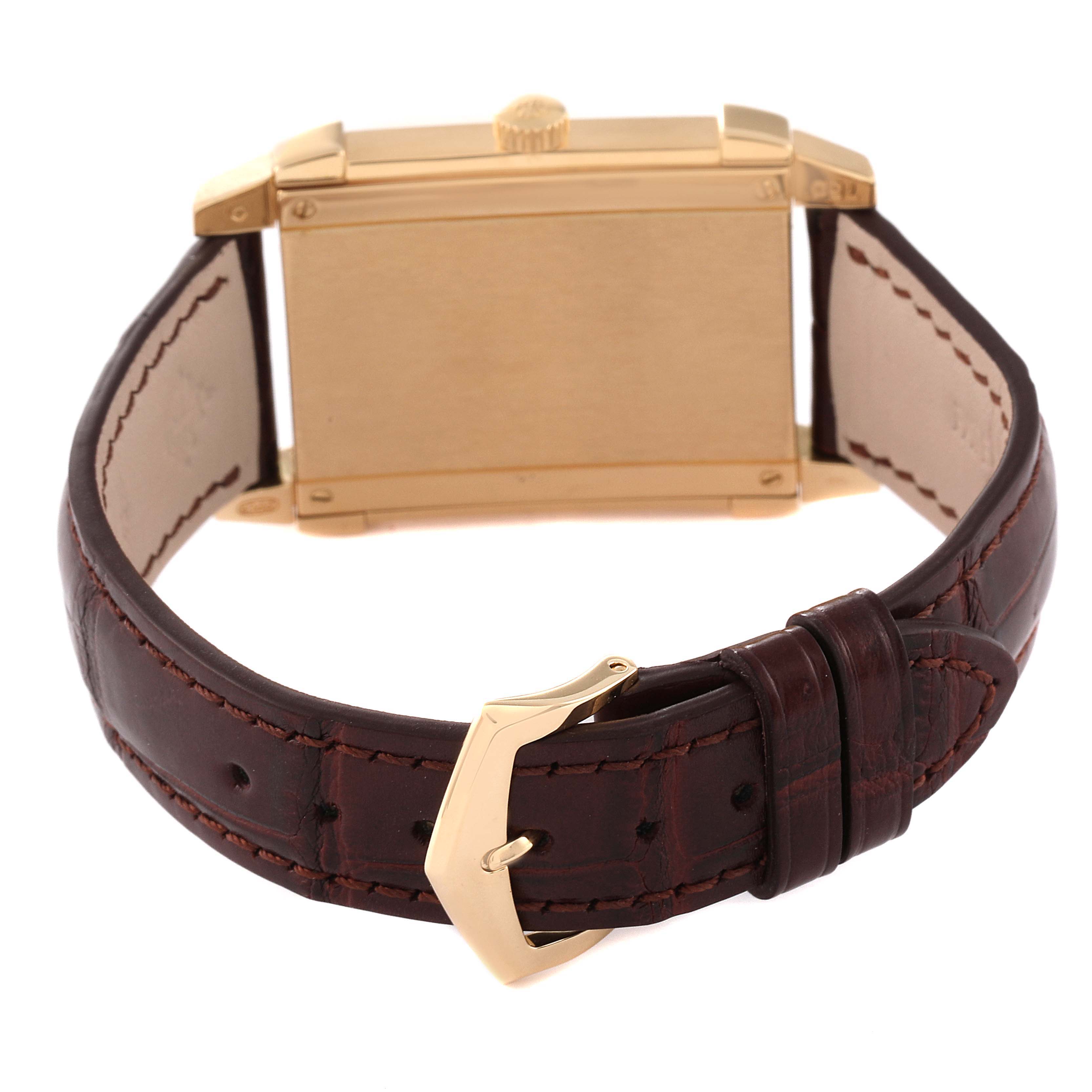 The image shows the back view of a Patek Philippe Gondolo 5111J Men's Yellow Gold Silver Dial 5111J Men's Yellow Gold Silver Dial watch, highlighting the case, crown, and brown leather strap with a gold buckle.