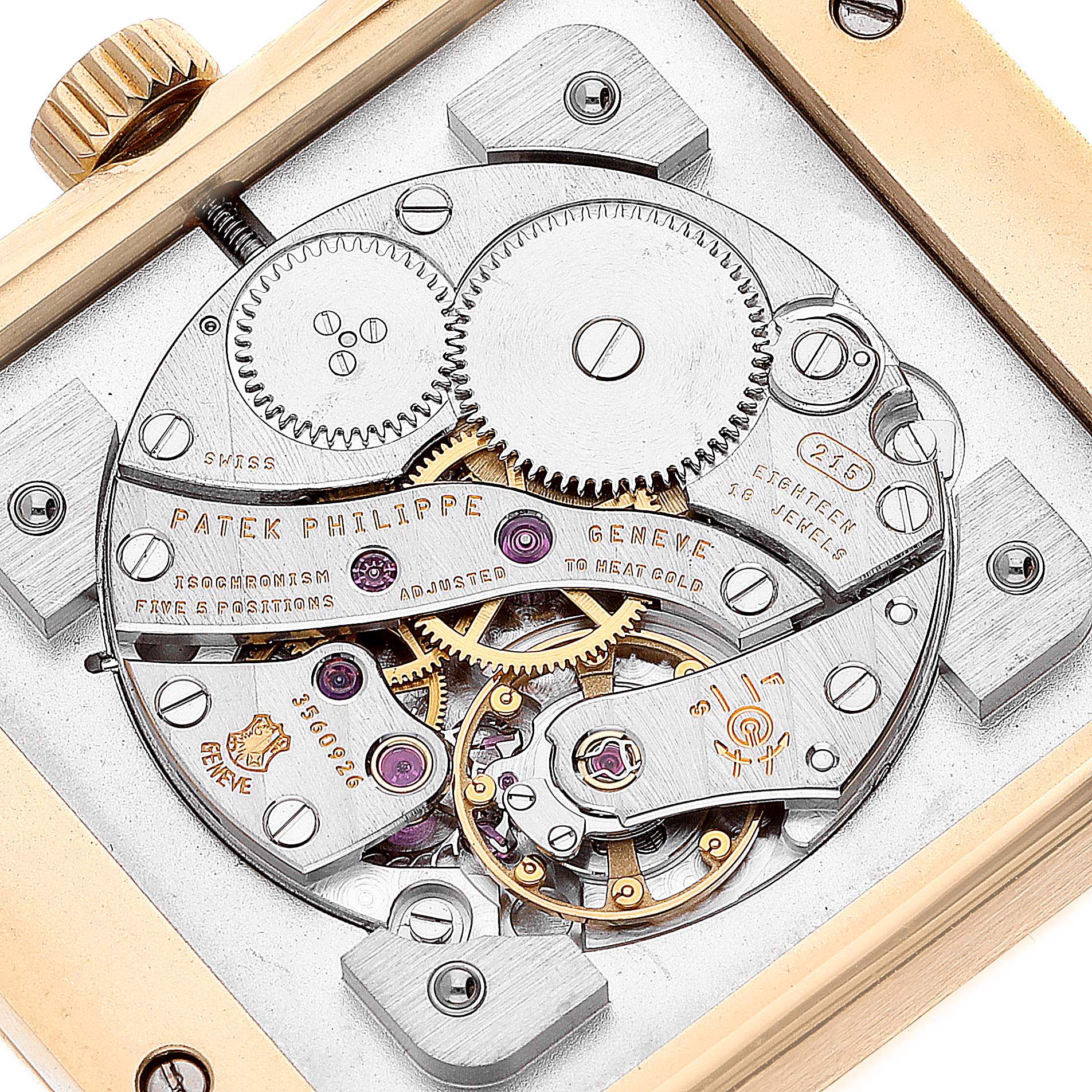 The image shows a close-up of the Patek Philippe Gondolo 5111J Men's Yellow Gold Silver Dial 5111J Men's Yellow Gold Silver Dial watch movement from a top-down angle, showcasing its intricate mechanics.