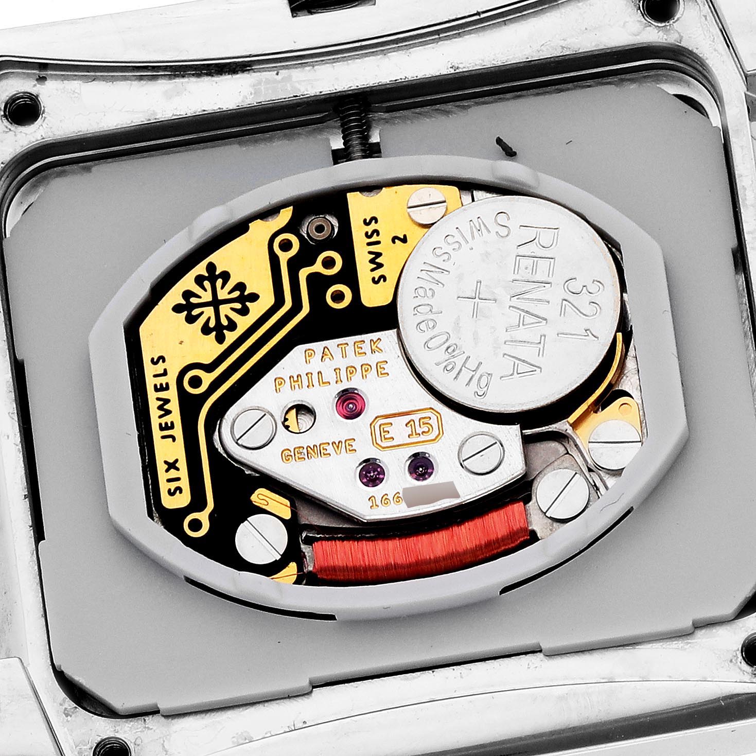 This image shows the movement and battery compartment of the Patek Philippe Twenty-4 4910 Women's Stainless Steel Black Dial 4910 Women's Stainless Steel Black Dial model from a top-down angle.
