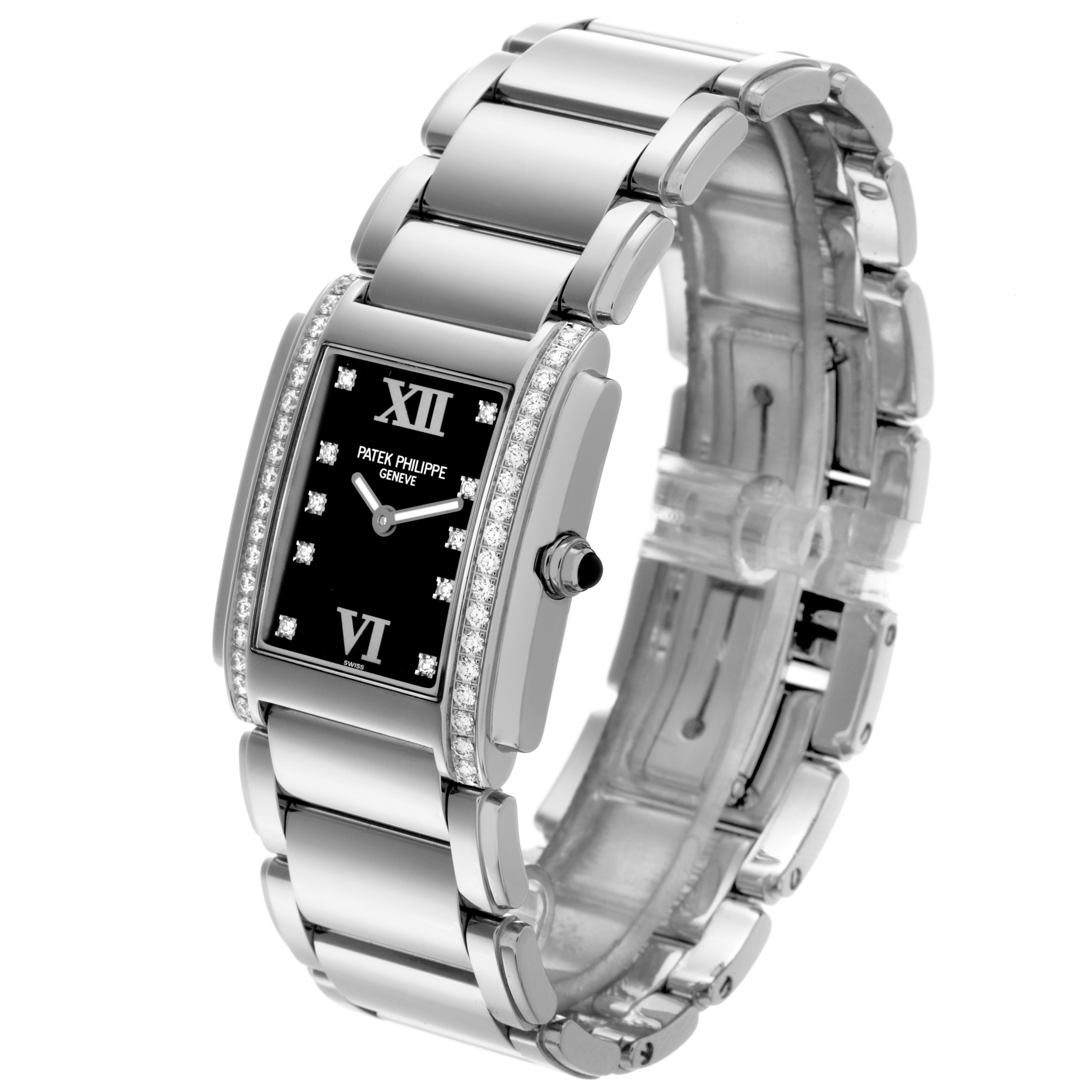 The Patek Philippe Twenty-4 4910 Women's Stainless Steel Black Dial 4910 Women's Stainless Steel Black Dial watch is shown at an oblique angle, highlighting its bracelet, diamond-set bezel, and black dial.