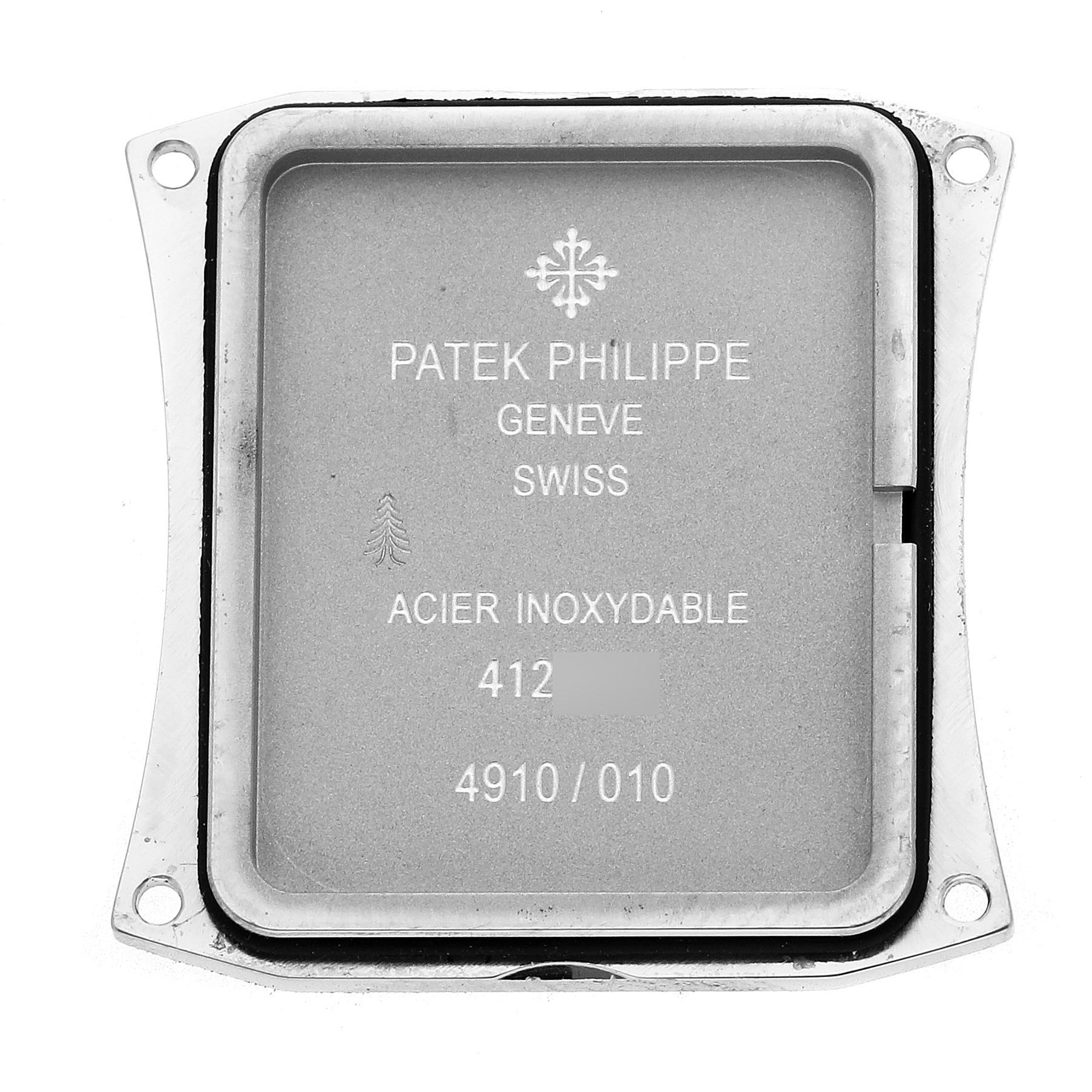 The image shows the back cover of a Patek Philippe Twenty-4 4910 Women's Stainless Steel Black Dial 4910 Women's Stainless Steel Black Dial watch, featuring inscriptions and a logo.
