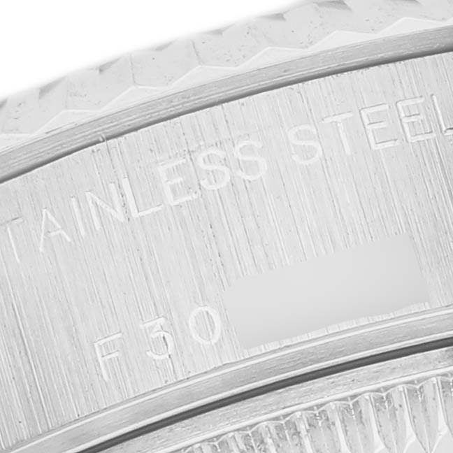 The image shows a close-up of the case edge and bezel engravings on a Rolex Datejust 79174 Men's Stainless Steel Mother of Pearl Dial watch.