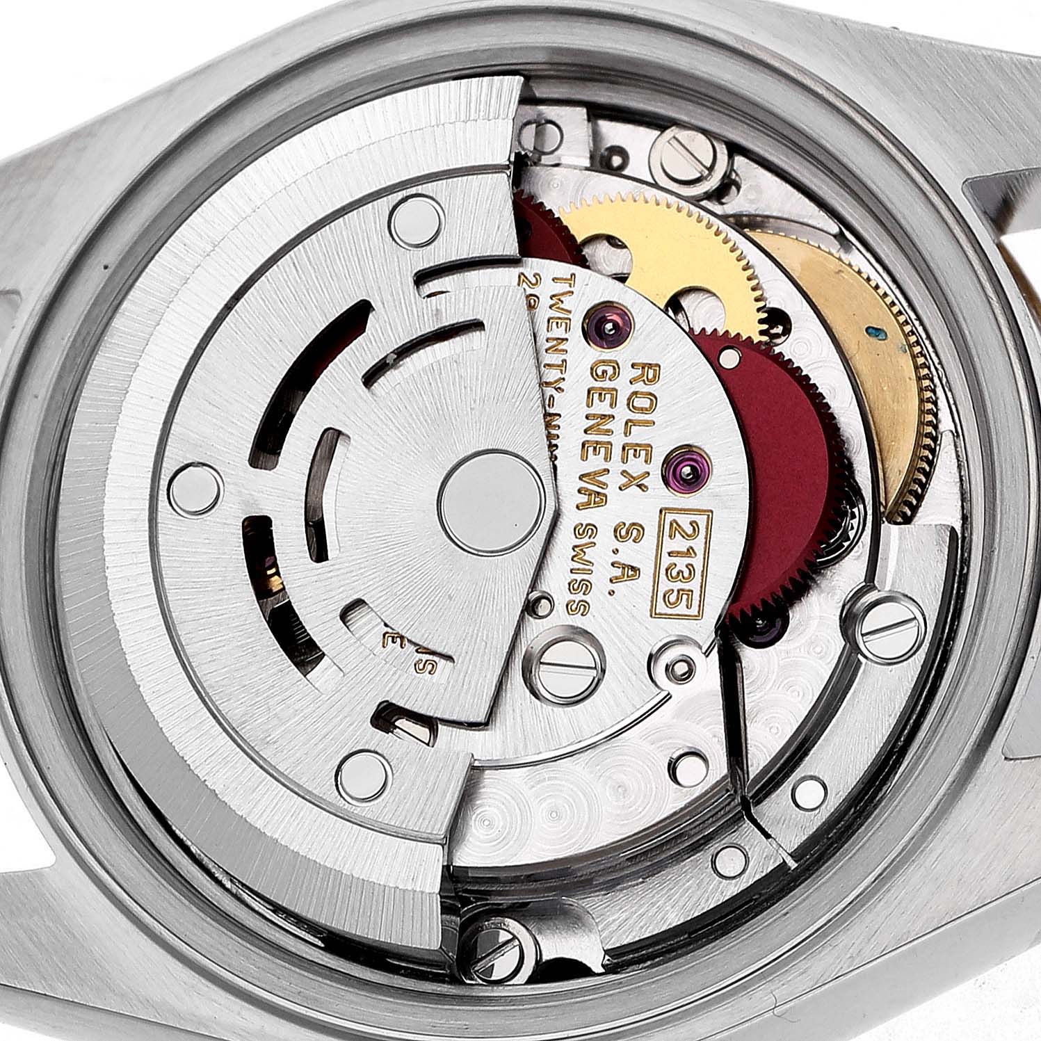 The image shows a close-up of the movement inside a Rolex Datejust 69173 Women's Steel and Gold (two tone) White Dial, highlighting gears and the rotor.