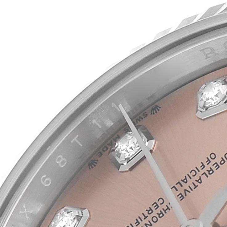 The image shows a close-up of the Datejust model by Rolex, focusing on the dial, hour markers, and part of the bezel.
