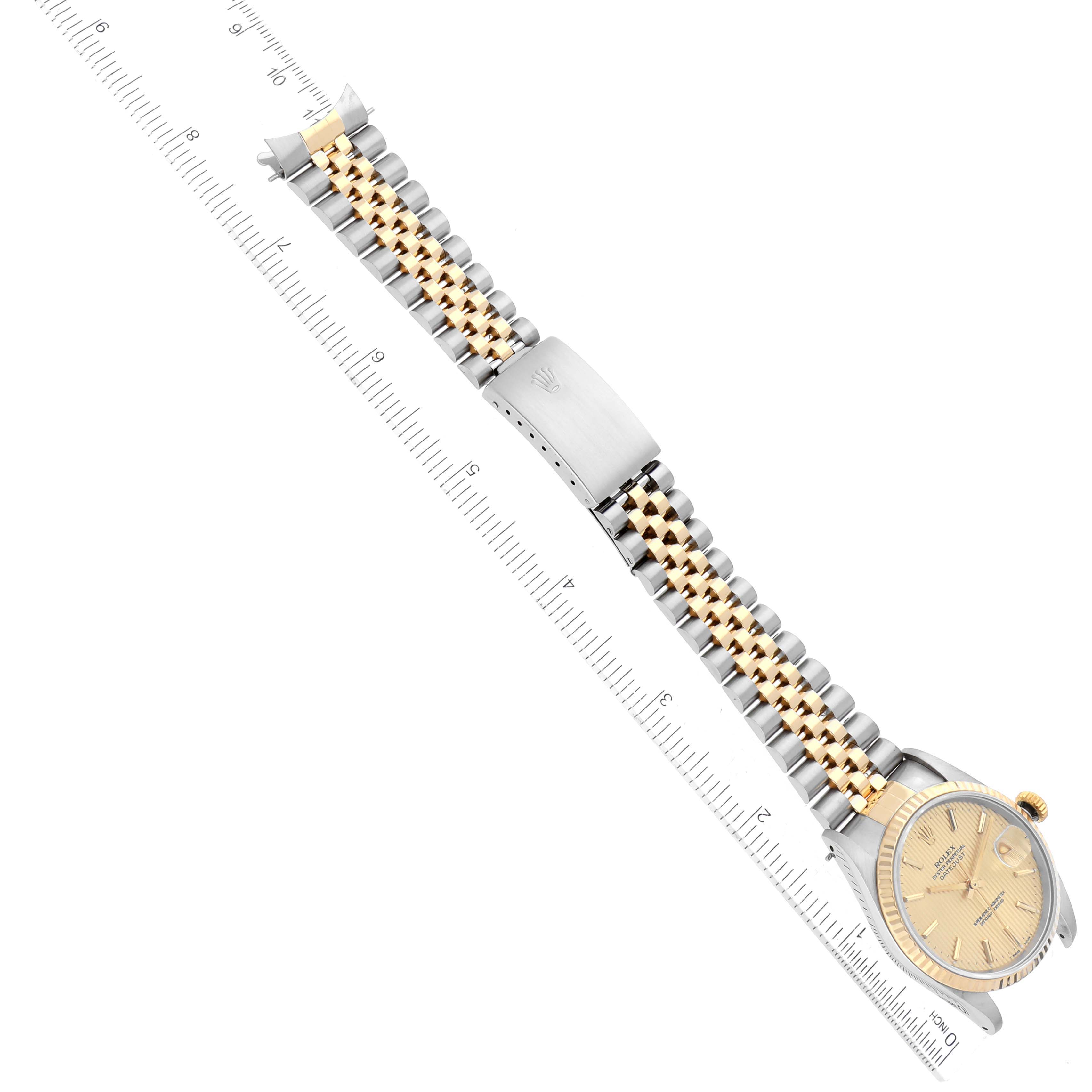 The image shows a top-down view of a Rolex Datejust 16233 Men's Steel and Gold (two tone) Champagne Dial 16233 Men's Steel and Gold (two tone) Champagne Dial model watch, highlighting its dial, bracelet, and clasp.