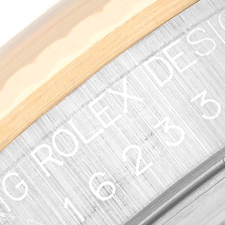This close-up image shows the engraved inner bezel of a Rolex Datejust 16233 Men's Steel and Gold (two tone) Champagne Dial 16233 Men's Steel and Gold (two tone) Champagne Dial watch.