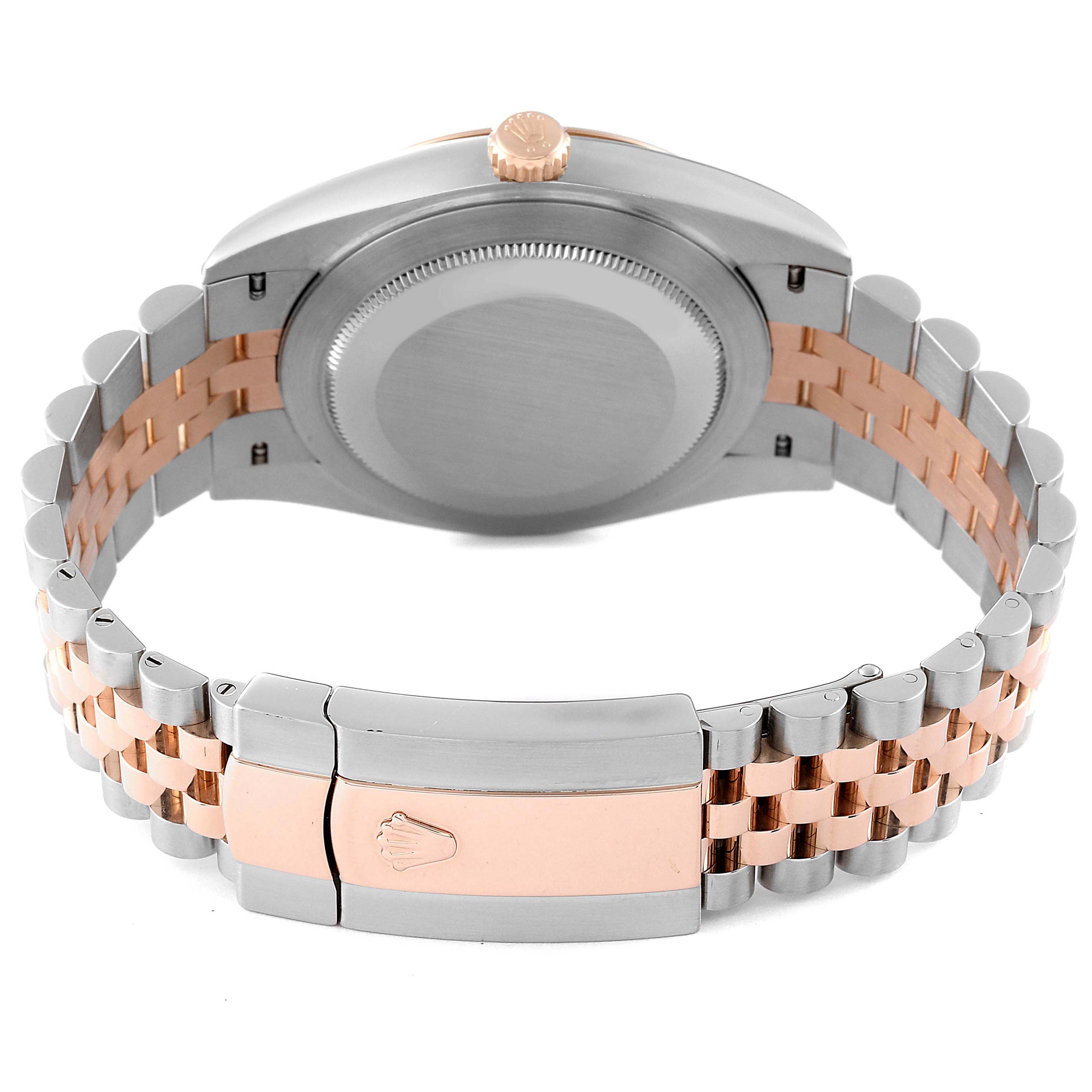 This image shows the back view of the Rolex Datejust 41 126301 Men
s Steel and Gold (two tone) Pink Dial 126301 Men
s Steel and Gold (two tone) Pink Dial watch, highlighting its clasp, bracelet, and case back.