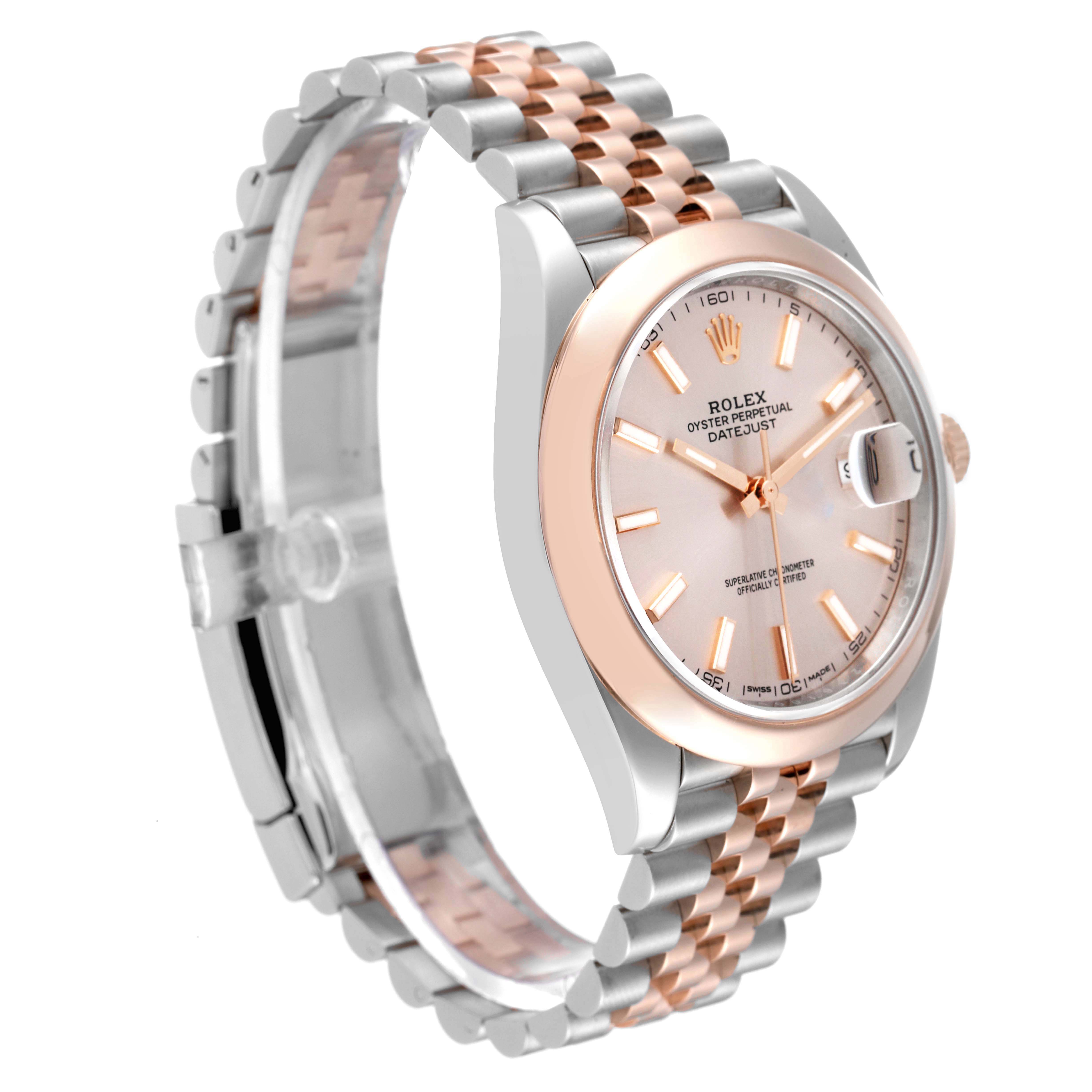 The Rolex Datejust 41 126301 Men
s Steel and Gold (two tone) Pink Dial is shown at a three-quarter angle, highlighting its rose gold and steel case, bezel, and Jubilee bracelet.