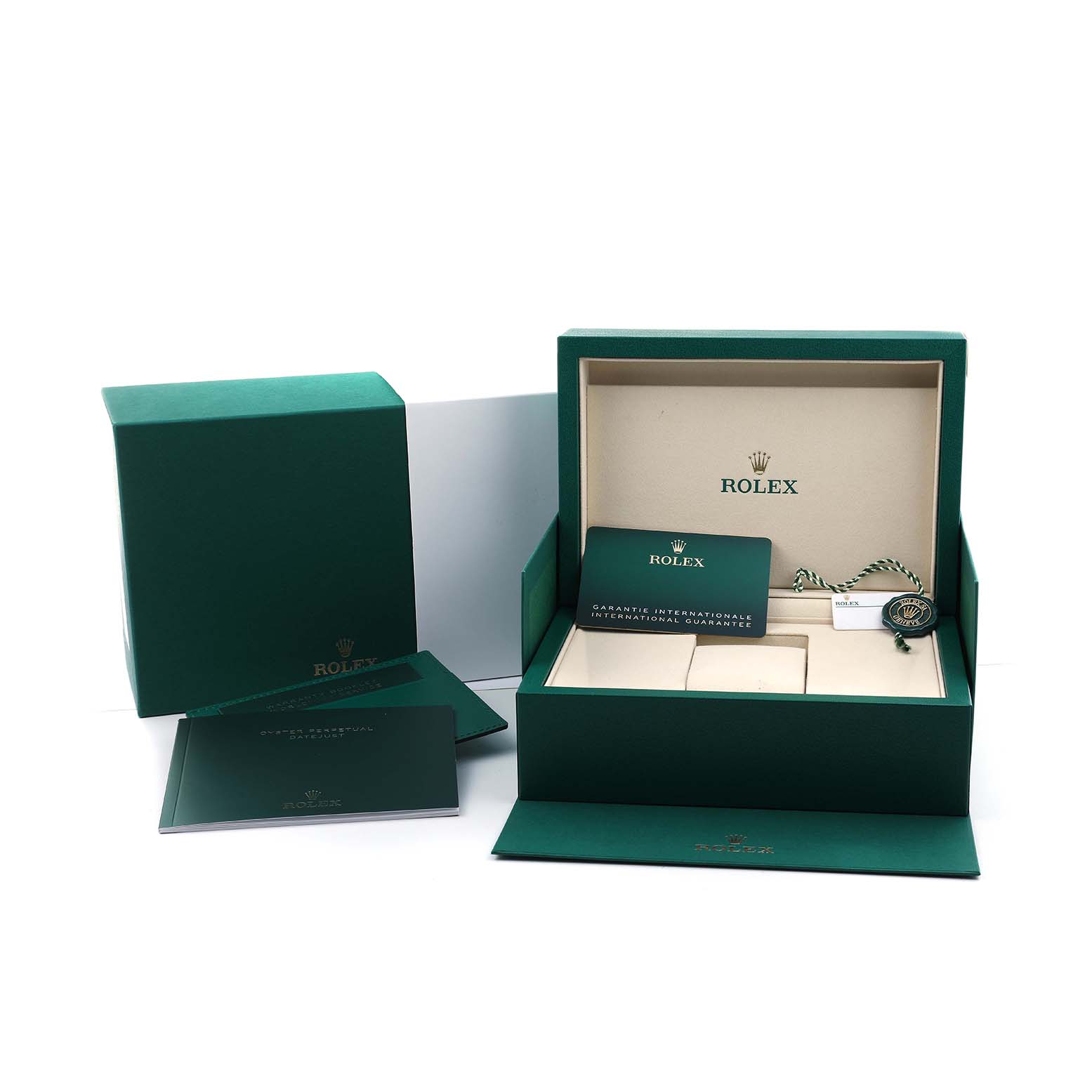 The image shows the packaging and accessories for the Rolex Datejust 41 M126334-0024 Men's Stainless Steel White Dial, including the box, papers, and tag.