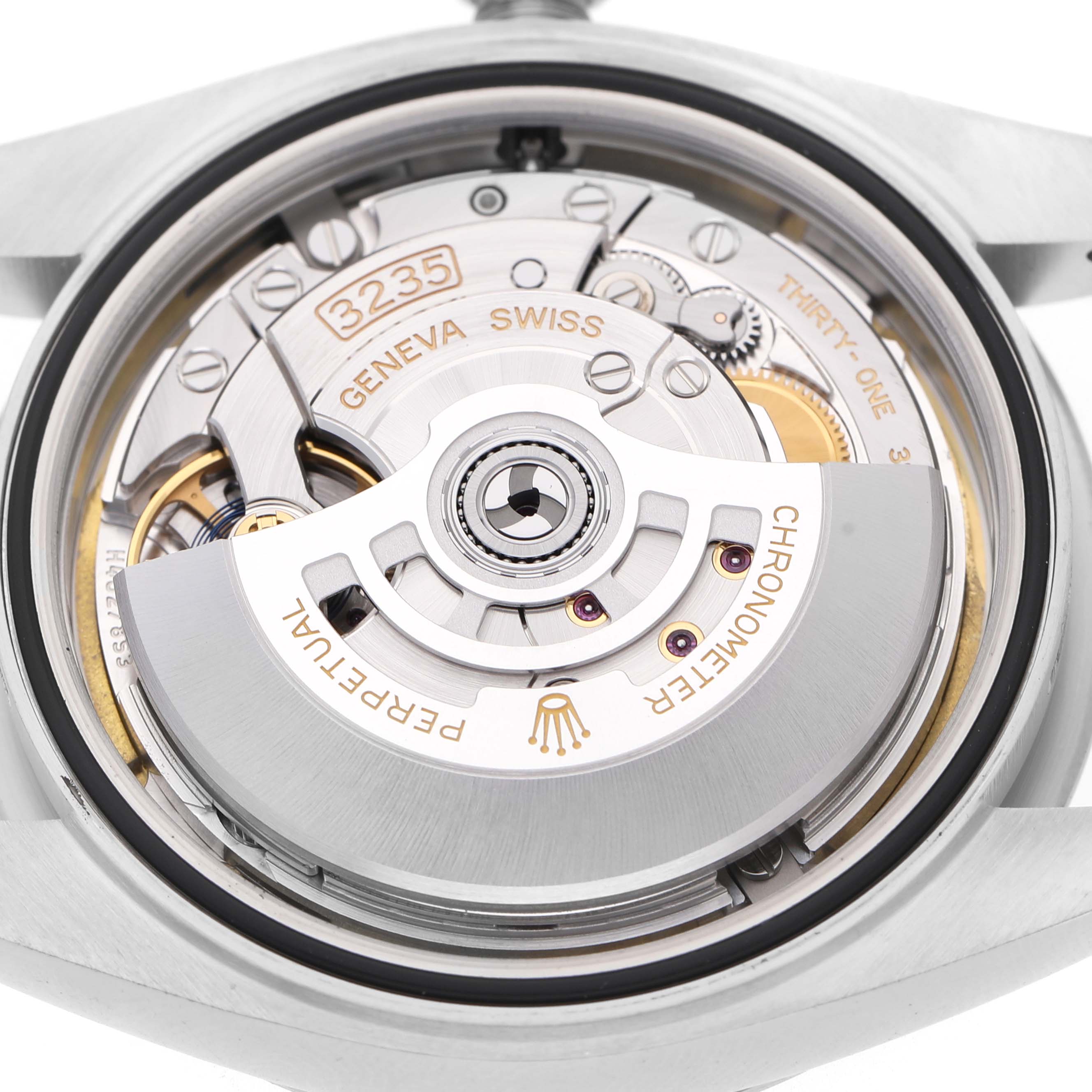 The image shows the movement of the Rolex Datejust 41 M126334-0024 Men's Stainless Steel White Dial, focusing on the intricate internal mechanism at an overhead angle.