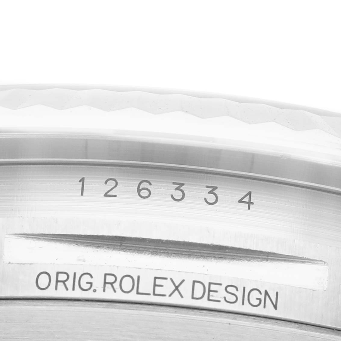 This image shows a close-up view of the Rolex Datejust 41 M126334-0024 Men's Stainless Steel White Dial model's case and bezel with "Orig. Rolex Design" engraved.