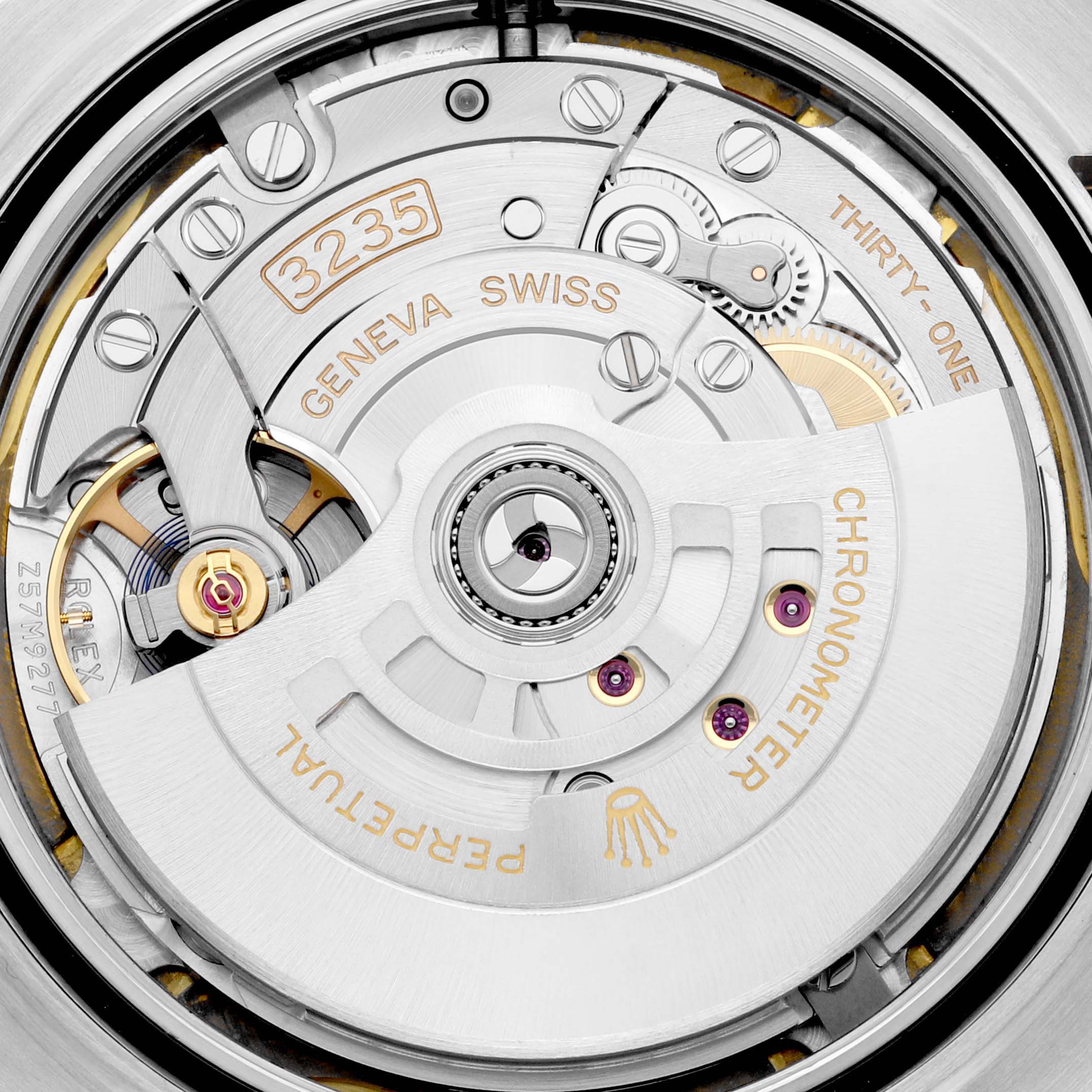 This image shows the movement mechanism from the back of a Rolex Datejust 41 126333 Men's Steel and Gold (two tone) White Dial 126333 Men's Steel and Gold (two tone) White Dial watch, highlighting the rotor and various gears.