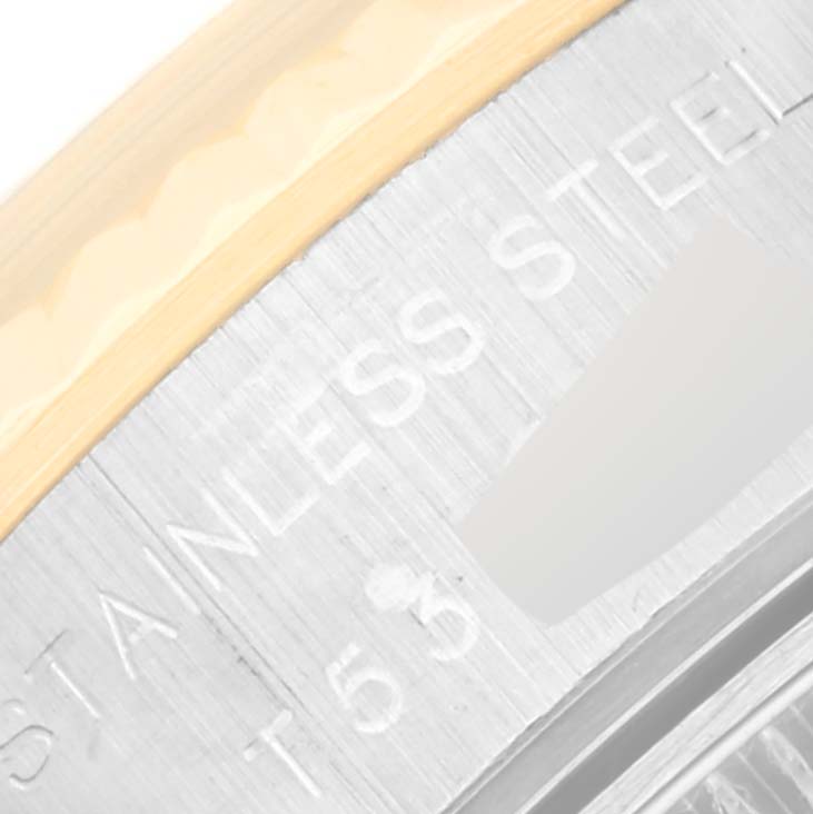 This close-up image shows part of the bezel and case of a Rolex Datejust 69173 Women's Steel and Gold (two tone) Blue Dial 69173 Women's Steel and Gold (two tone) Blue Dial watch, highlighting the "STAINLESS STEEL" engraving.