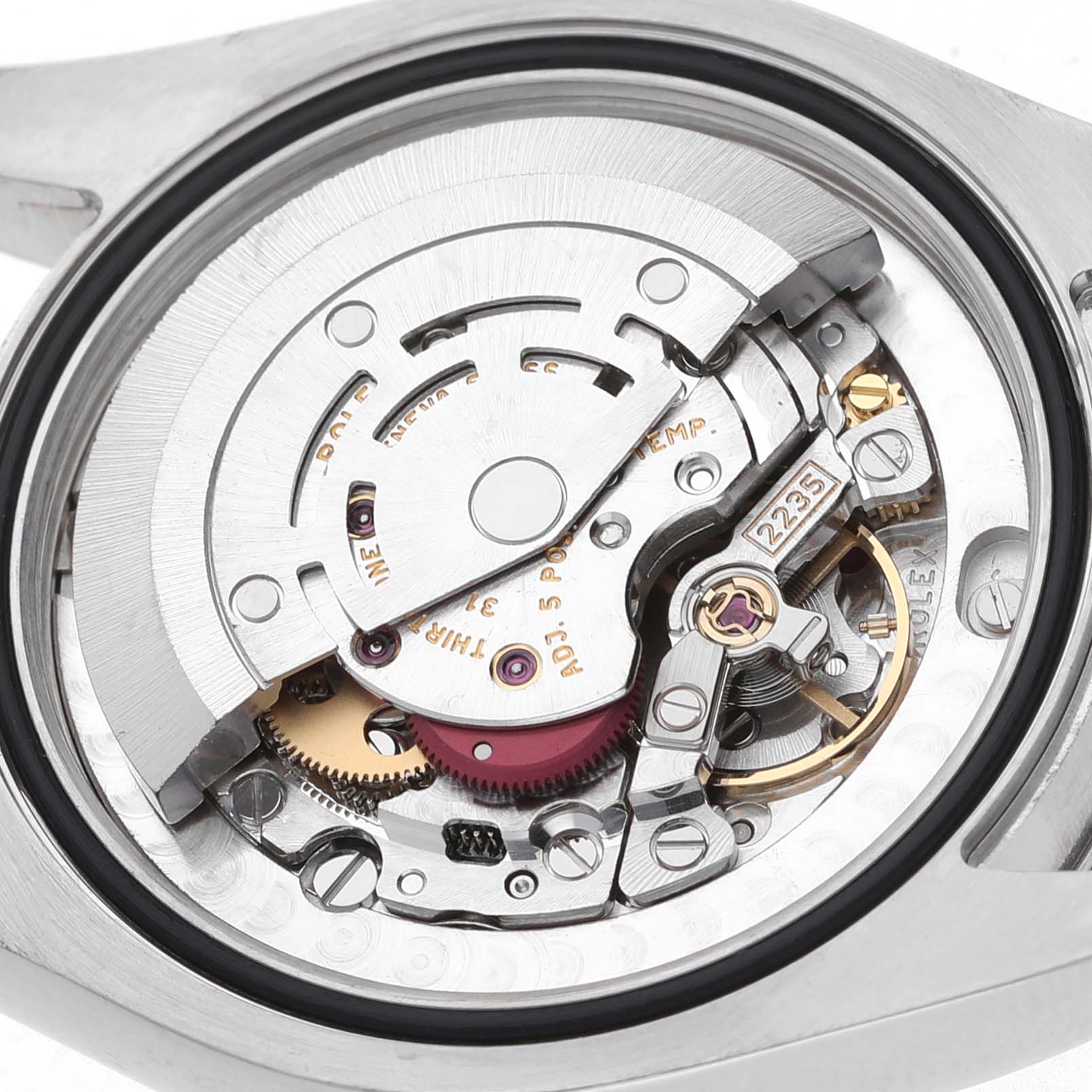 The image shows the internal movement of a Rolex Datejust 178240 Women's Stainless Steel Grey Dial watch from a top-down angle, highlighting gears and mechanisms.