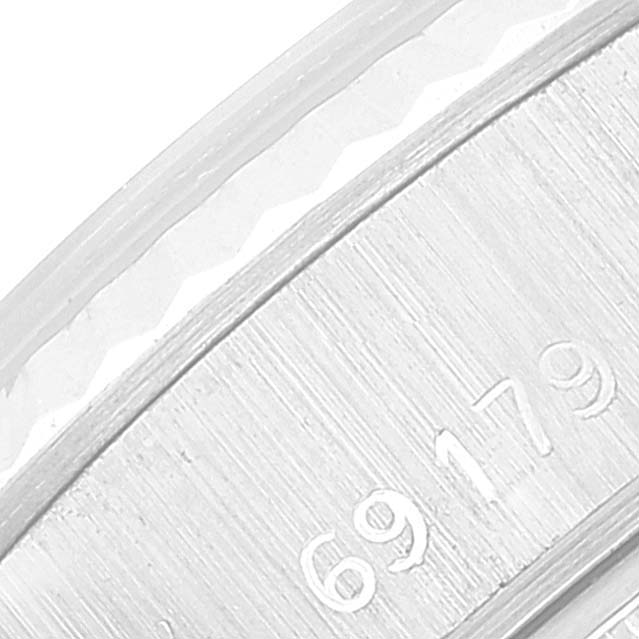The close-up image shows the engraved serial number on the inner bezel of a Rolex President 69179 Women's White Gold Grey Dial 69179 Women's White Gold Grey Dial model watch.