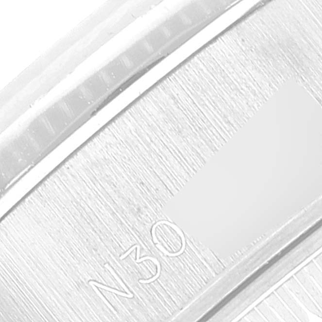 This image shows a close-up of the inner bezel of a Rolex President 69139 Women's White Gold Silver Dial 69139 Women's White Gold Silver Dial model watch.