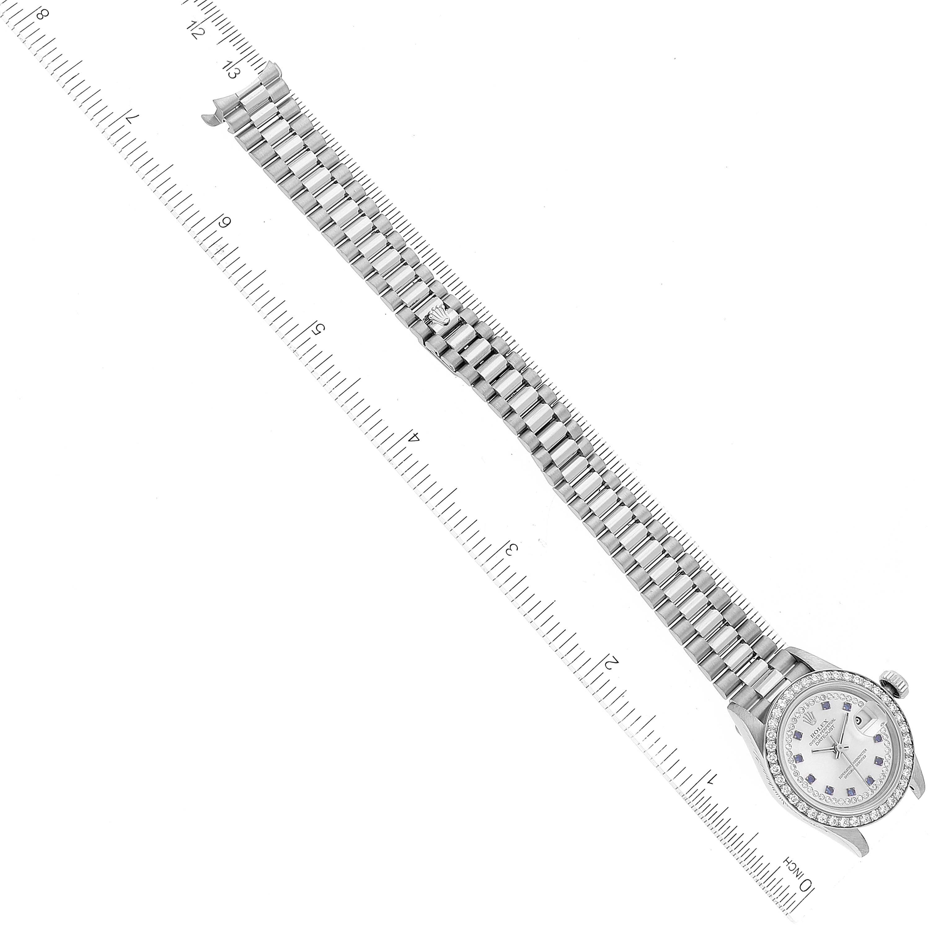 The image shows a top-down view of a Rolex President 69139 Women's White Gold Silver Dial 69139 Women's White Gold Silver Dial model watch, highlighting the entire bracelet and face.