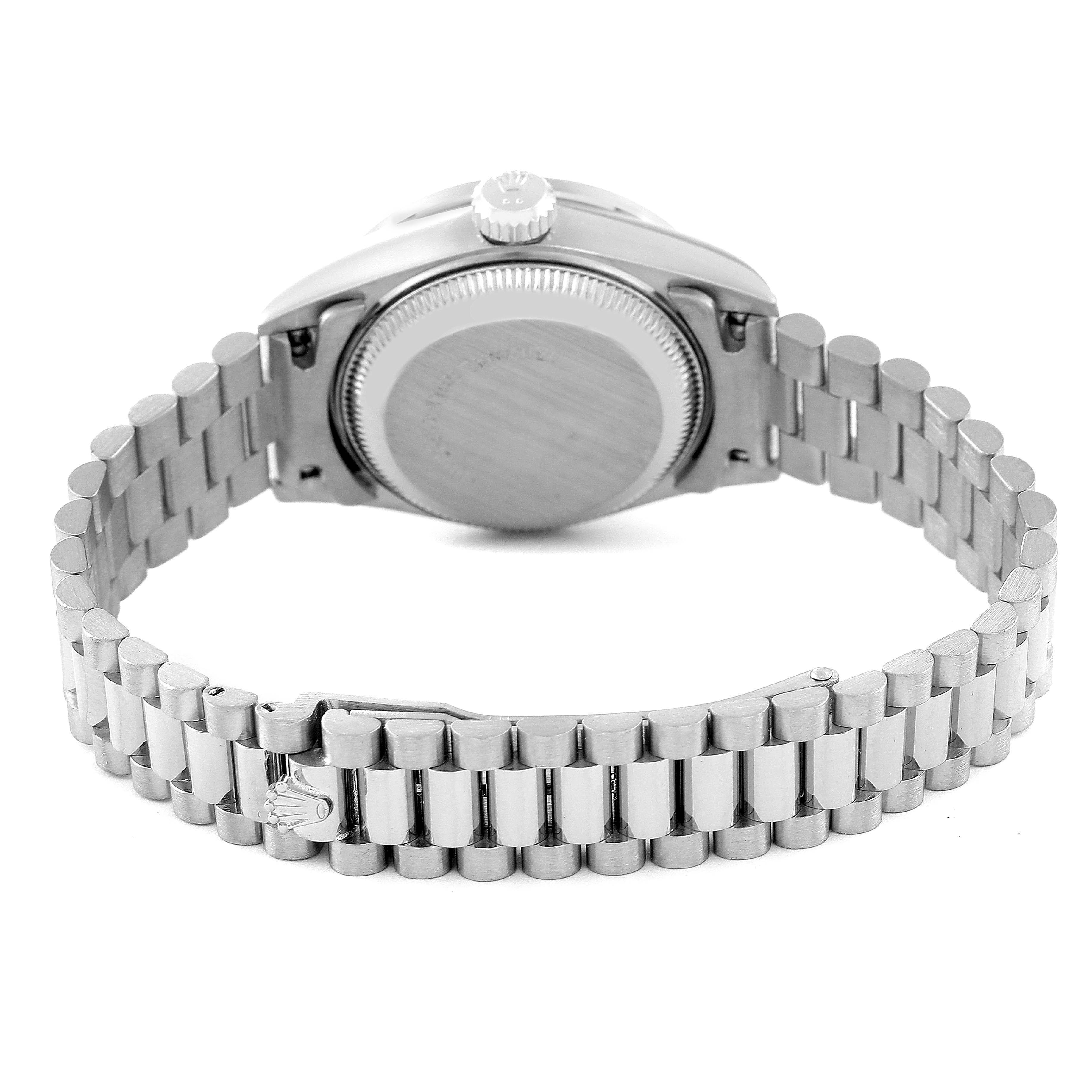 The image shows the back view of a Rolex President 69139 Women's White Gold Silver Dial 69139 Women's White Gold Silver Dial model watch, highlighting its clasp, bracelet, and back casing.