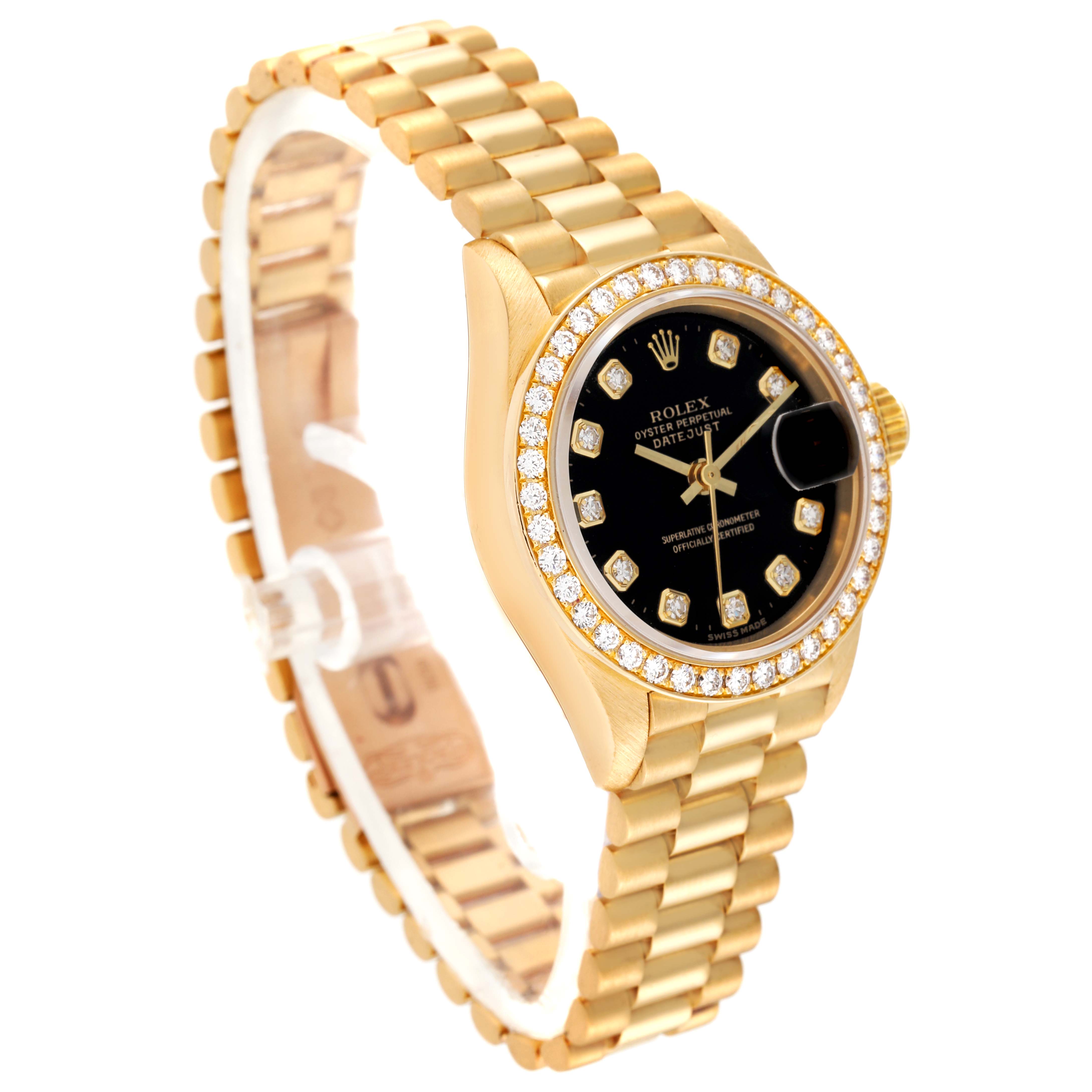 The Rolex President 69138 Women's Yellow Gold Black Dial 69138 Women's Yellow Gold Black Dial model watch is shown at a slight angle, displaying its gold bracelet, diamond-studded bezel, and black dial.