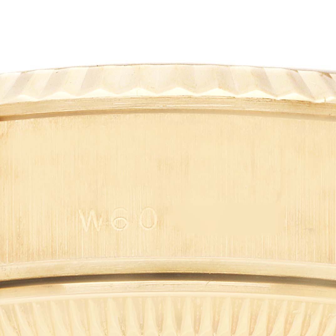 The image shows a close-up of the side of the Rolex President 69178 Women
s Yellow Gold Champagne Dial 69178 Women
s Yellow Gold Champagne Dial model watch, featuring the engraved model number.