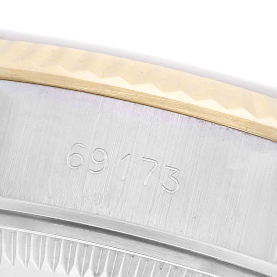 The image shows a close-up of the Rolex Datejust 69173 Women's Steel and Gold (two tone) Champagne Dial 69173 Women's Steel and Gold (two tone) Champagne Dial model with a focus on the case edge and model number engraving.