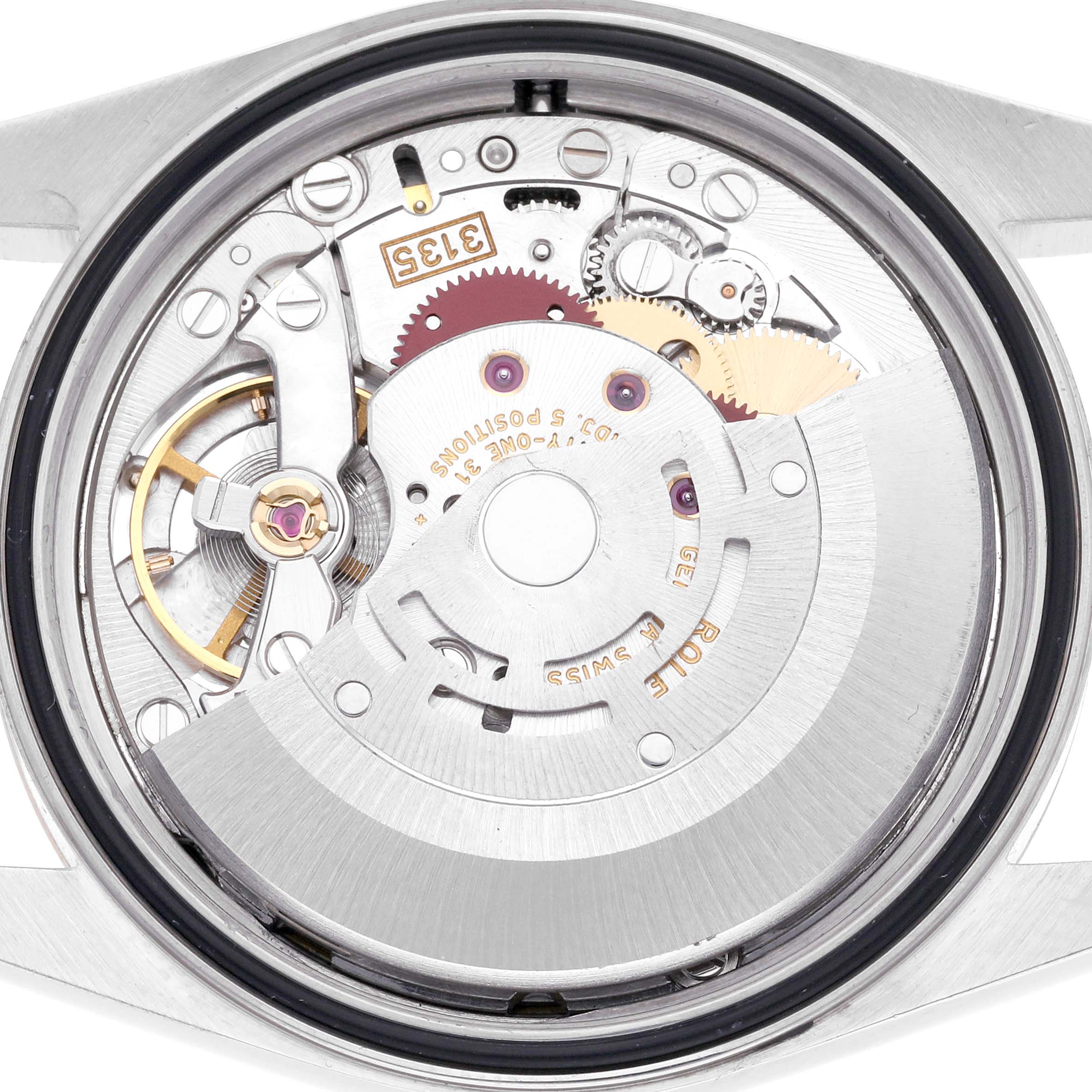 The image shows the movement of a Rolex Datejust 16233 Men's Steel and Gold (two tone) White Dial 16233 Men's Steel and Gold (two tone) White Dial watch from the back, highlighting the intricate gears and rotor.