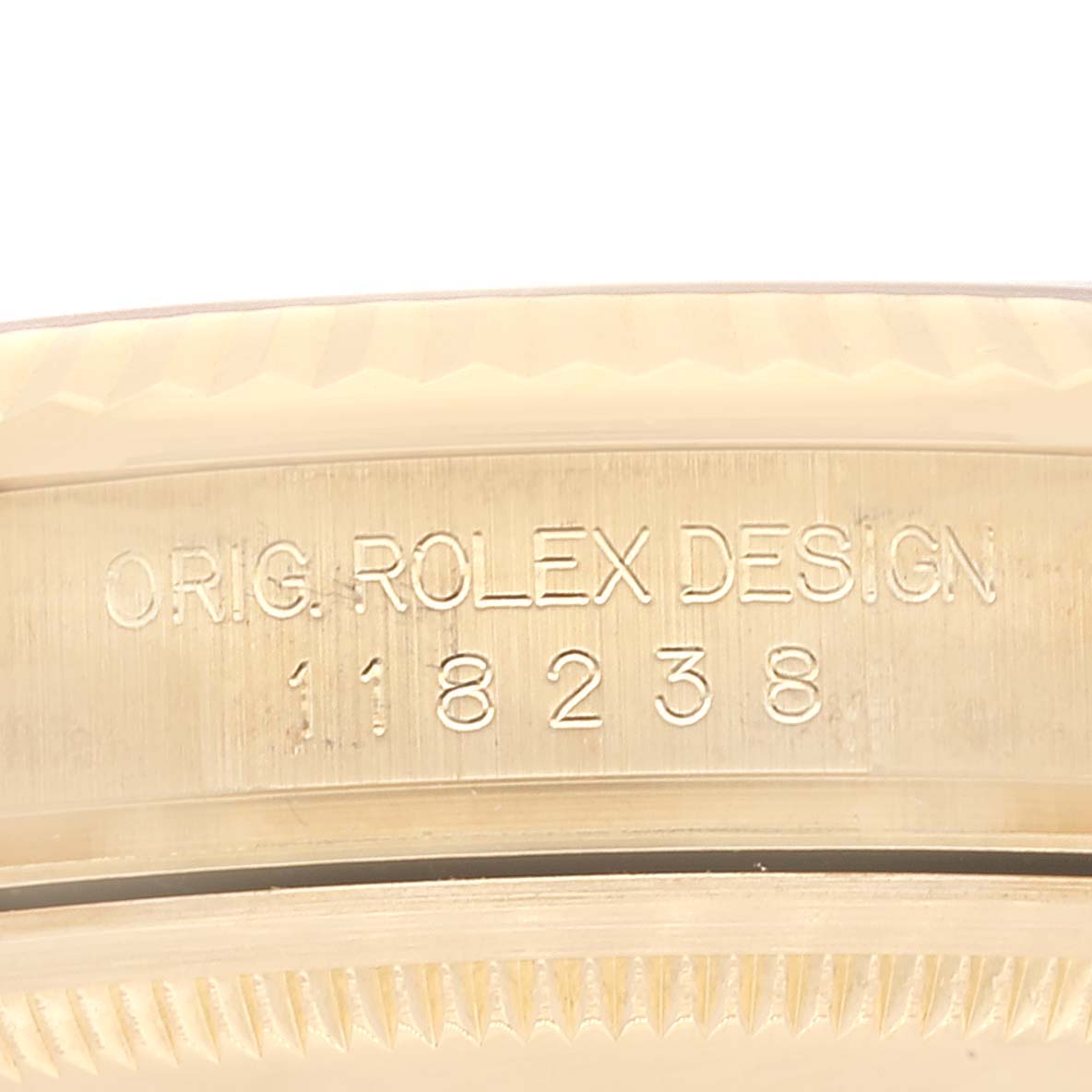 This image shows a close-up of the model number engraving on the Rolex President 118238 Men
s Yellow Gold Champagne Dial 118238 Men
s Yellow Gold Champagne Dial watch case.