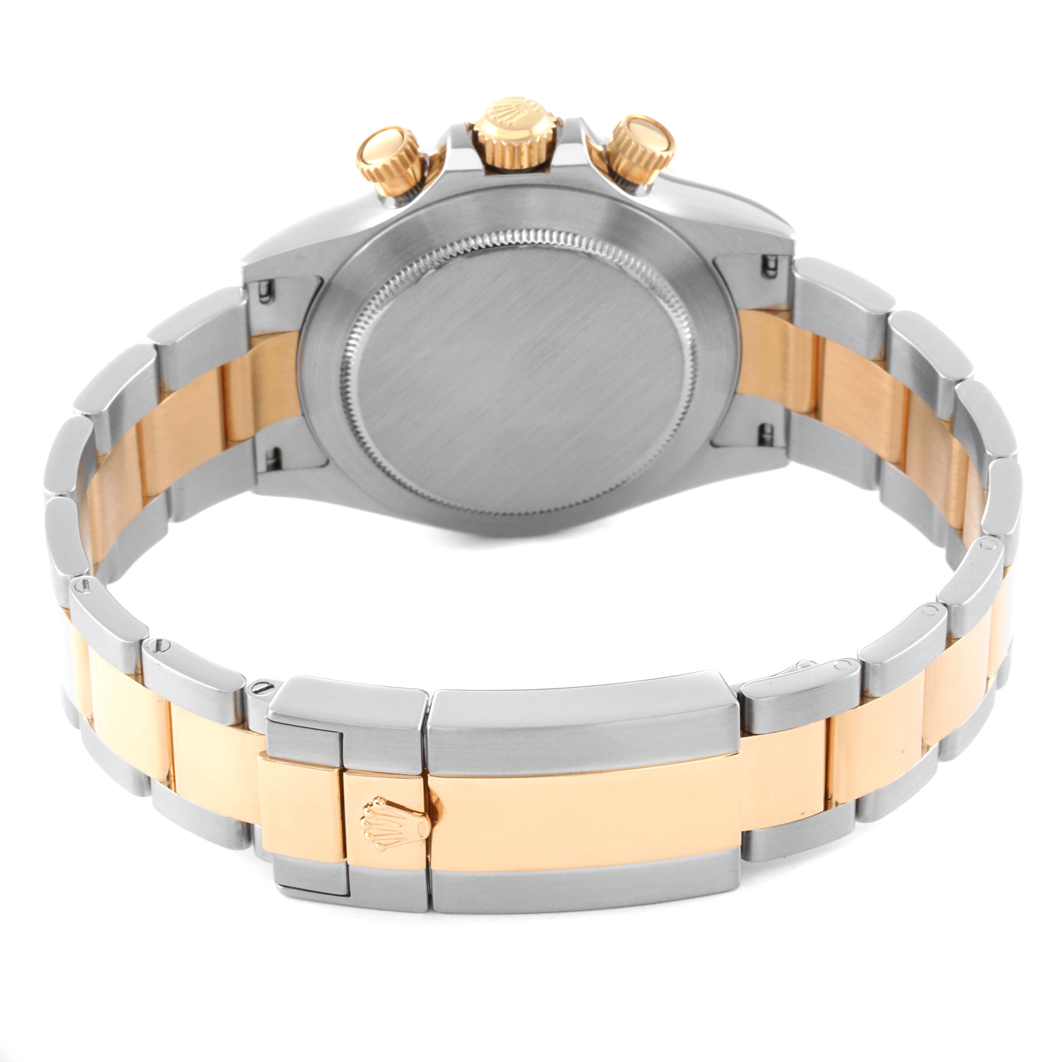 This image shows the back view of a Rolex Daytona 116523 Men
s Steel and Gold (two tone) Black Dial 116523 Men
s Steel and Gold (two tone) Black Dial watch with its clasp and bracelet visible.