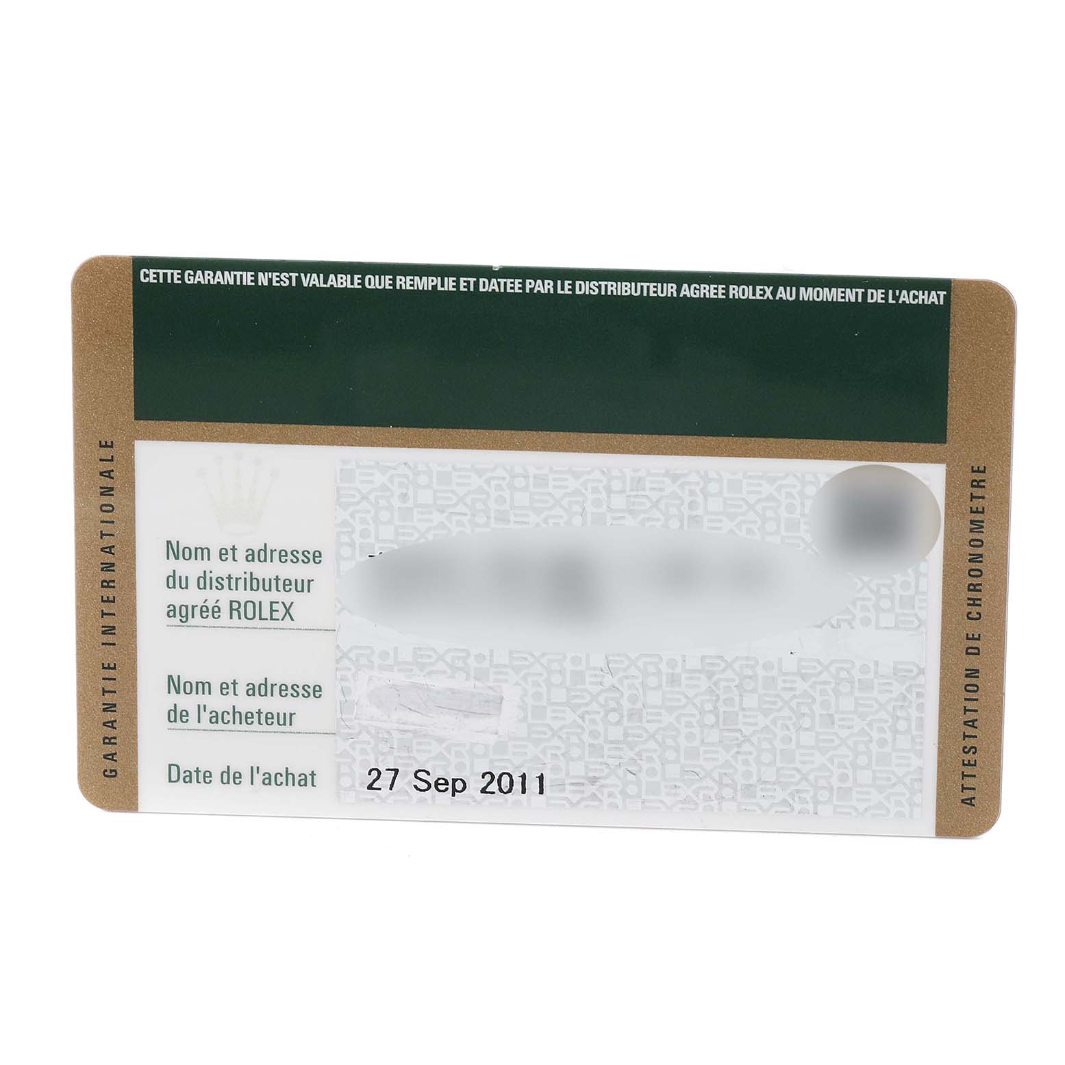 This image shows the warranty card for a Rolex Daytona 116523 Men
s Steel and Gold (two tone) Black Dial 116523 Men
s Steel and Gold (two tone) Black Dial, including the purchase date and distributor information.