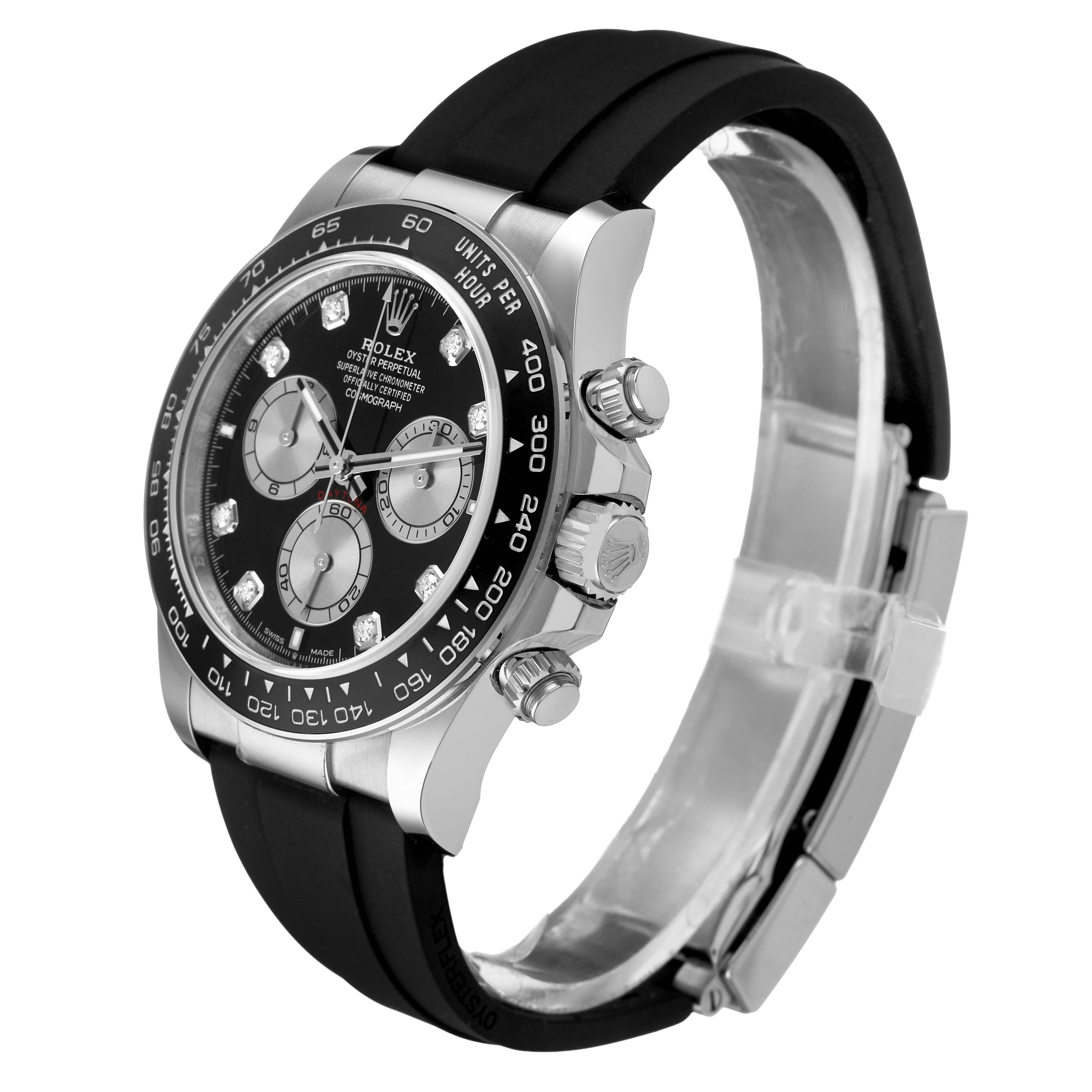 The Rolex Daytona 126519LN Men's White Gold Black Dial watch is shown at a three-quarter angle, highlighting its black dial, bezel, chronograph pushers, and rubber strap.