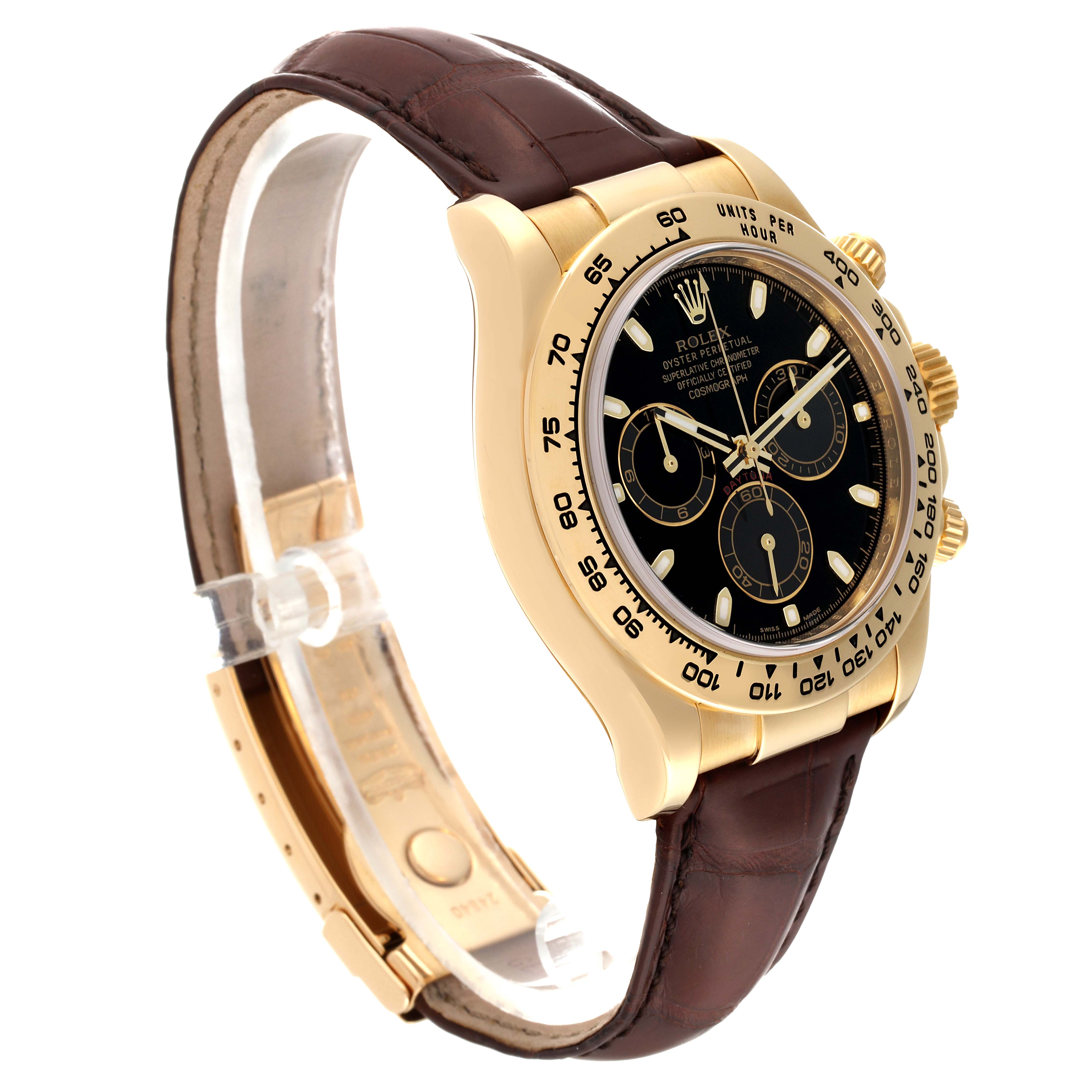 The Rolex Daytona M116518-0080 Men's Yellow Gold Black Dial M116518-0080 Men's Yellow Gold Black Dial watch is shown at an oblique angle, displaying its black dial, gold case, and brown leather strap.