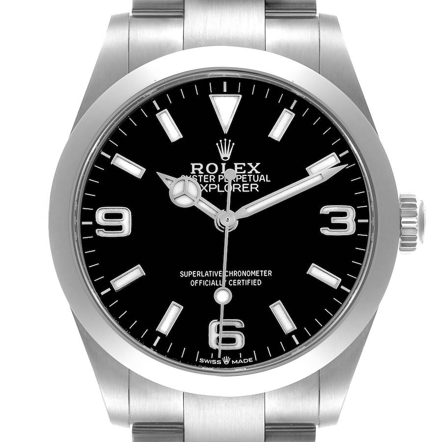 The Rolex Explorer watch is shown from a front angle, displaying the dial, hands, markers, and part of the bracelet.