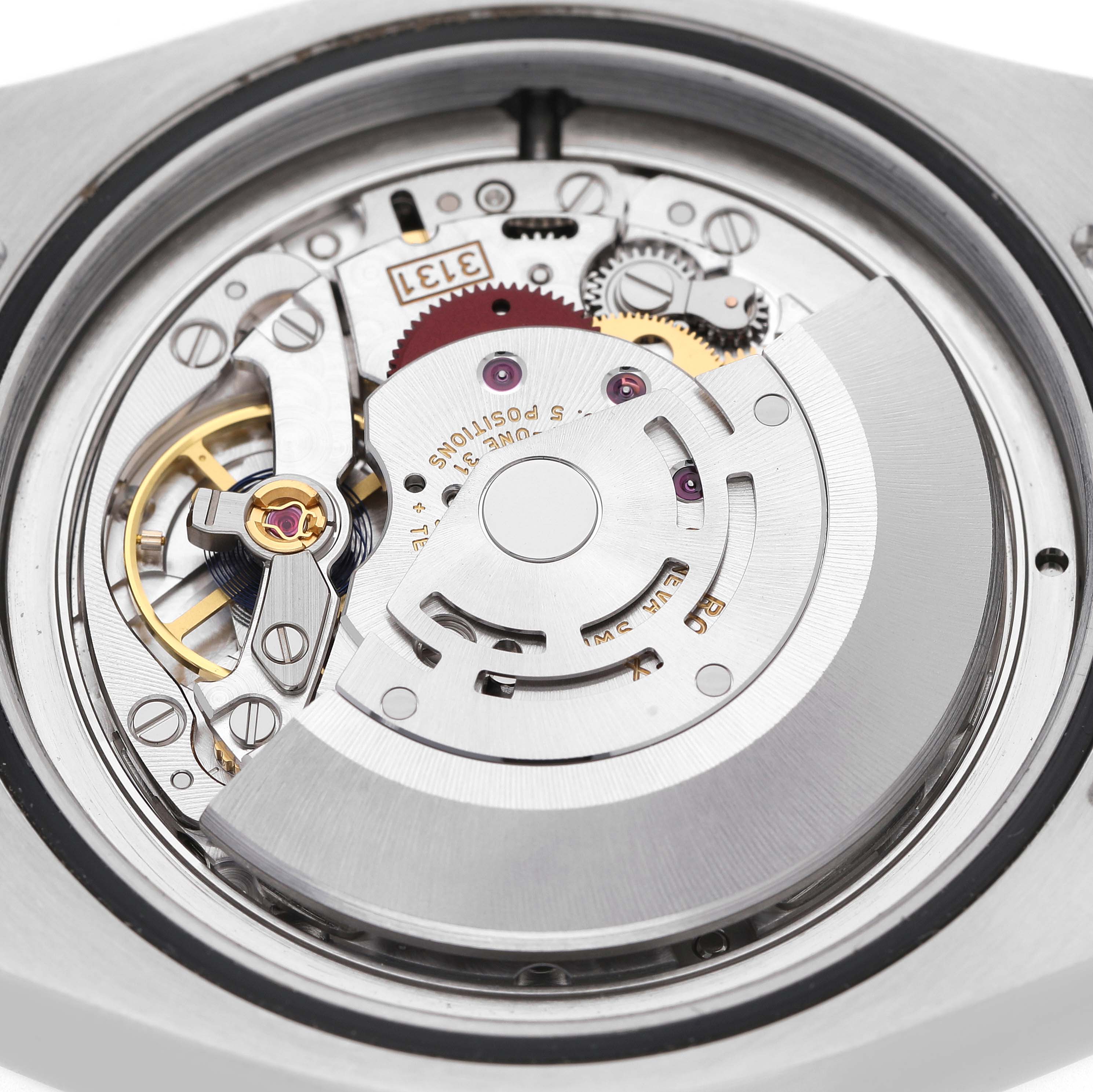The image shows the internal movement of a Rolex Milgauss M116400GV-0001 Men's Stainless Steel Black Dial watch from a top-down view, featuring gears and the rotor.
